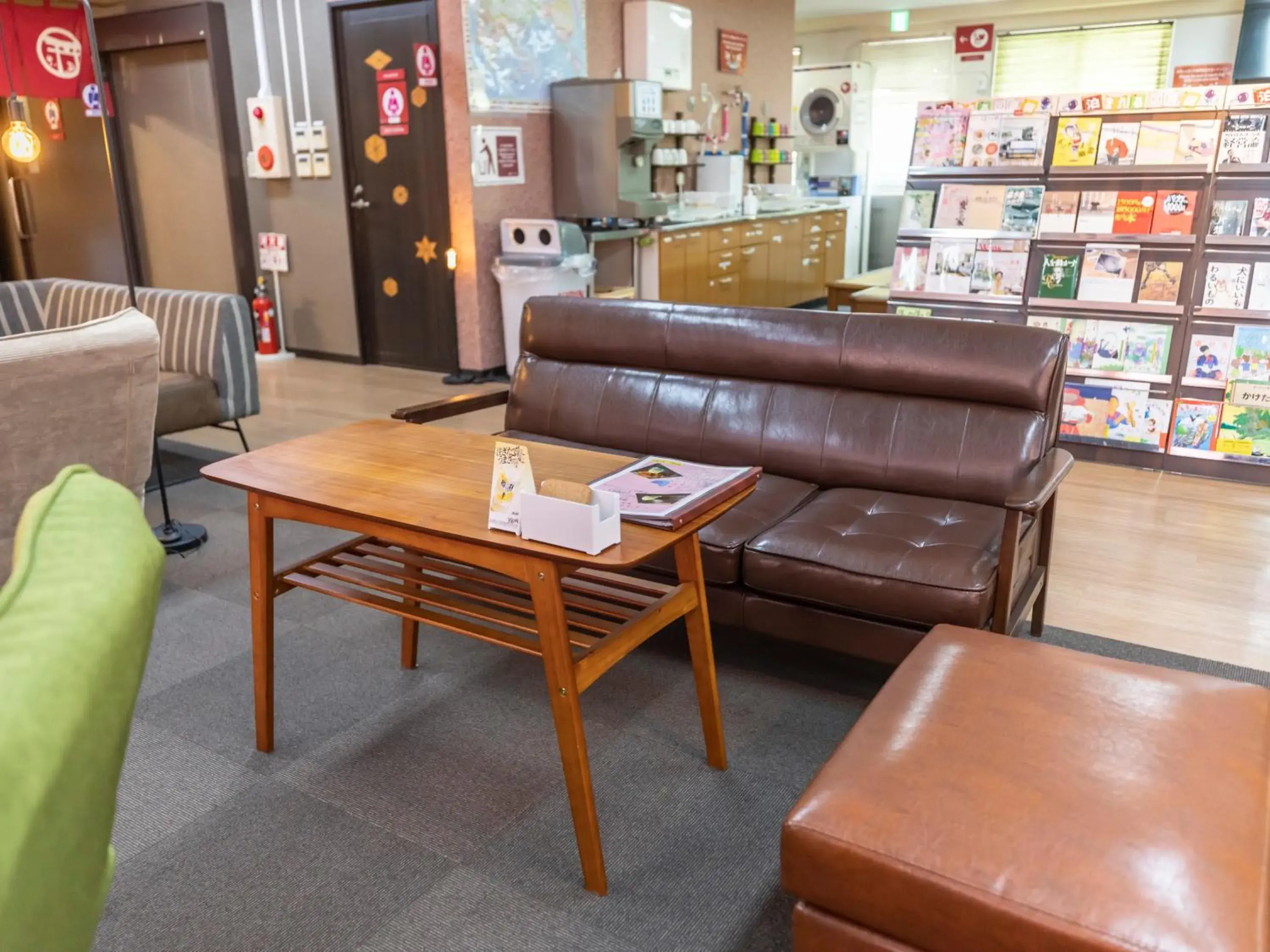 Communal lounge/ TV room, Seating Area in Omotenashi Hostel Miyajima