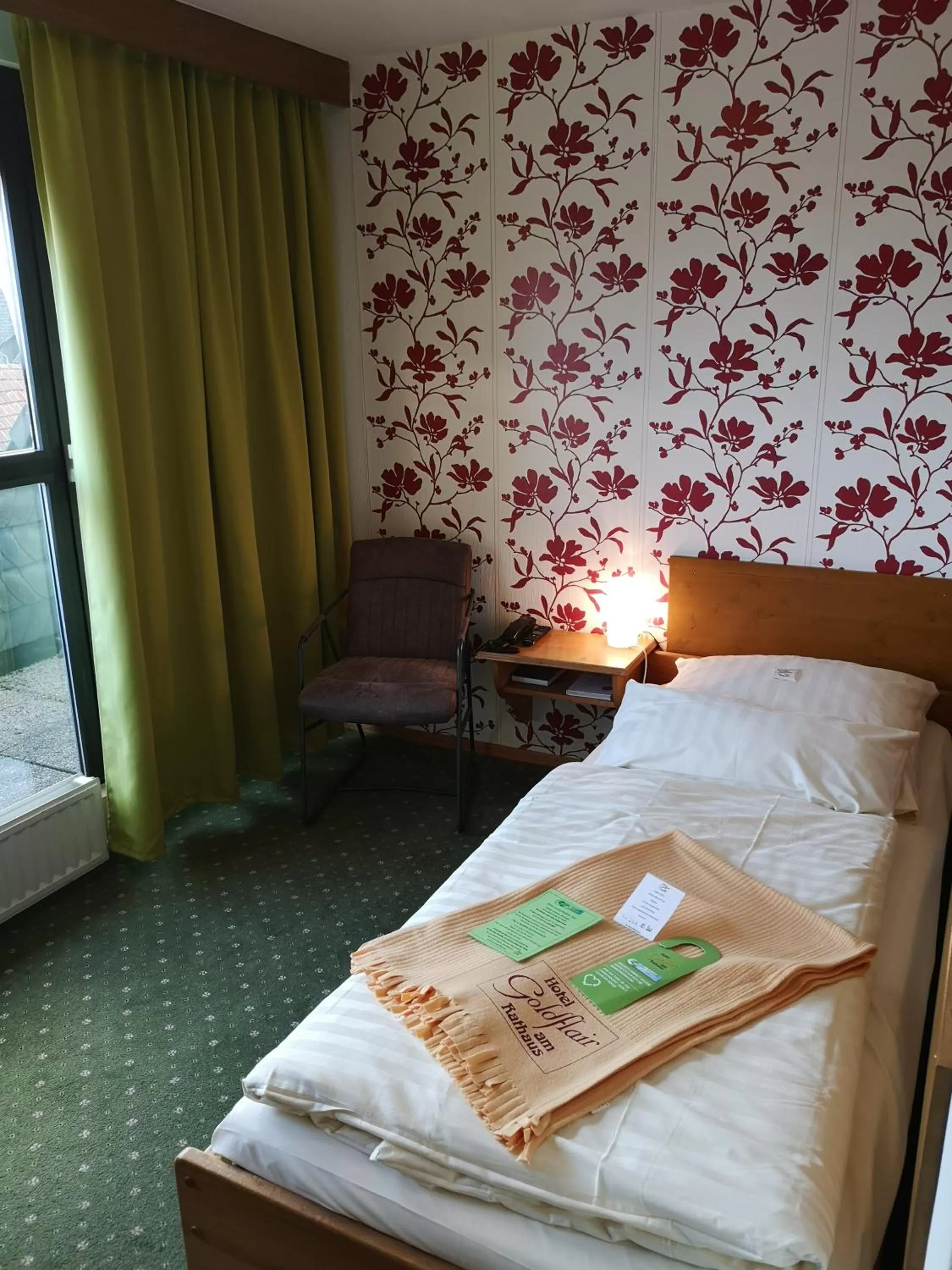 Photo of the whole room, Bed in Hotel Goldflair am Rathaus