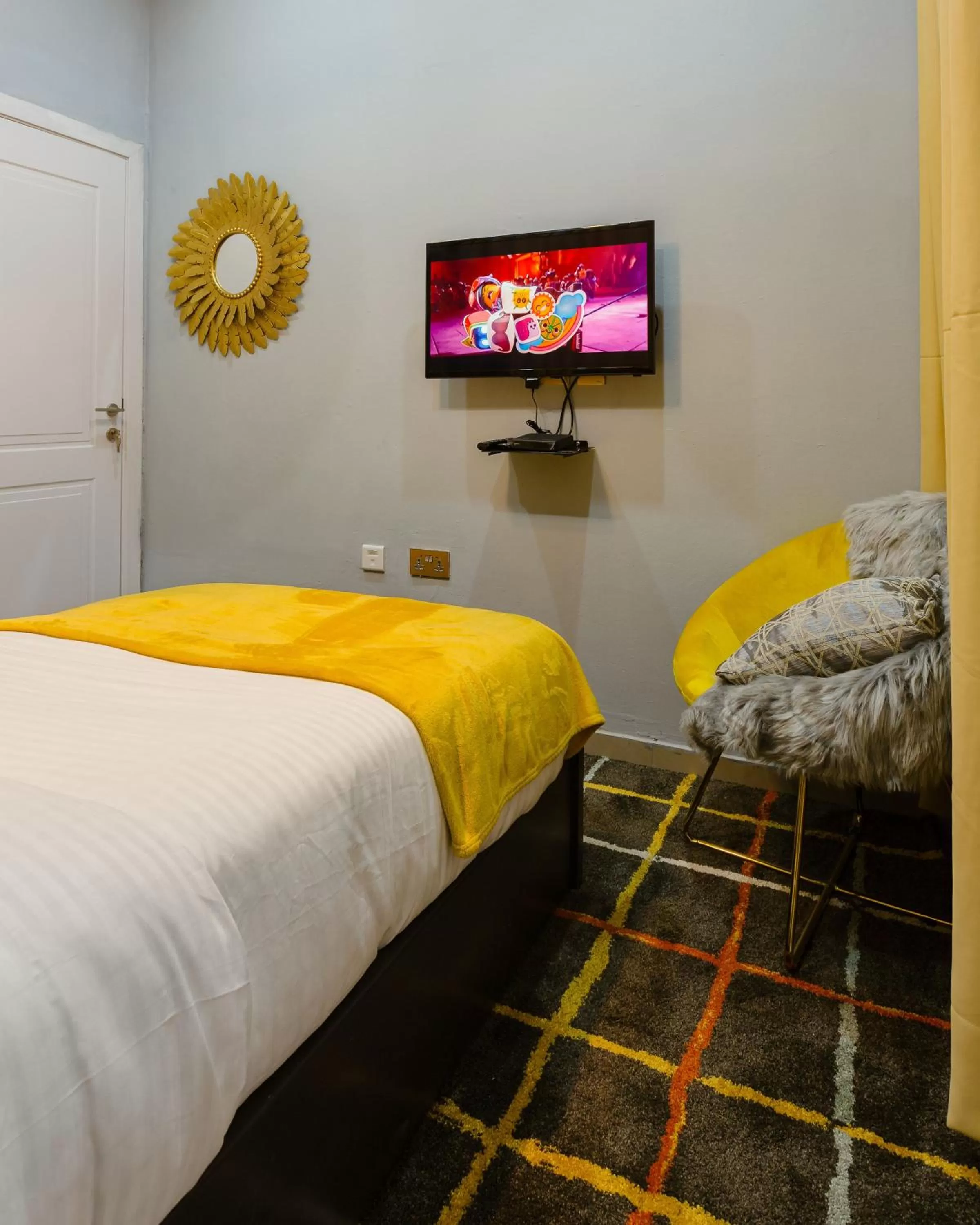 Bed in The Avery Suites, East Legon