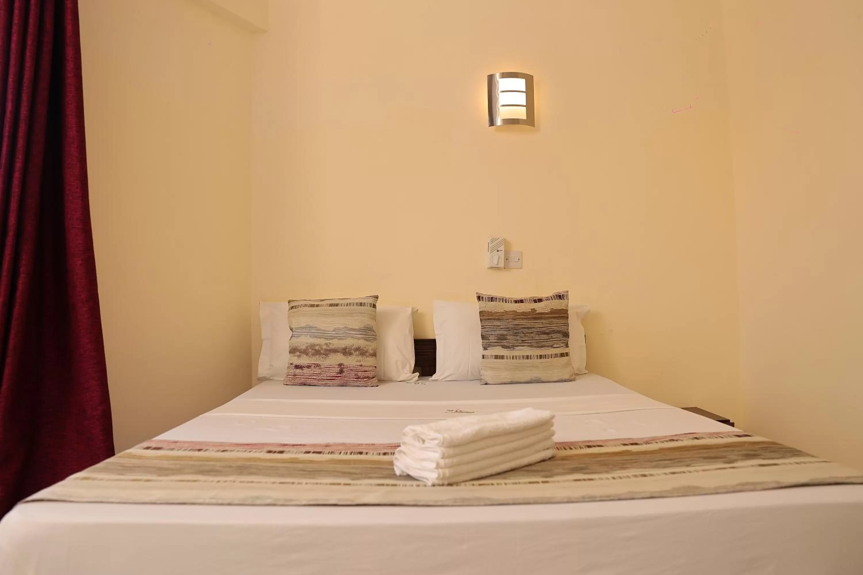 Bed in Merry Villa Hotel & Apartments