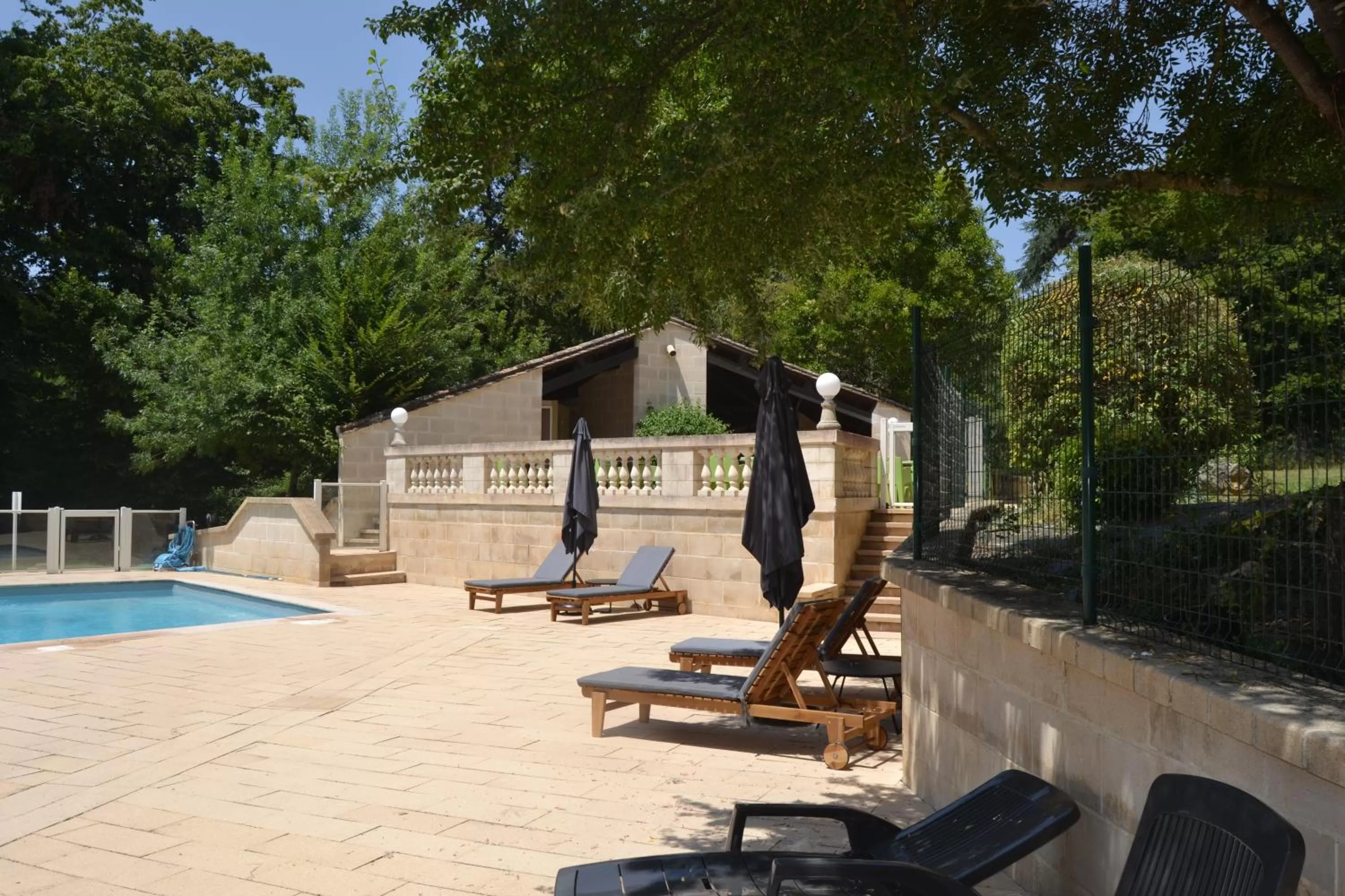 Swimming pool in Logis Hotels - Château Saint Marcel