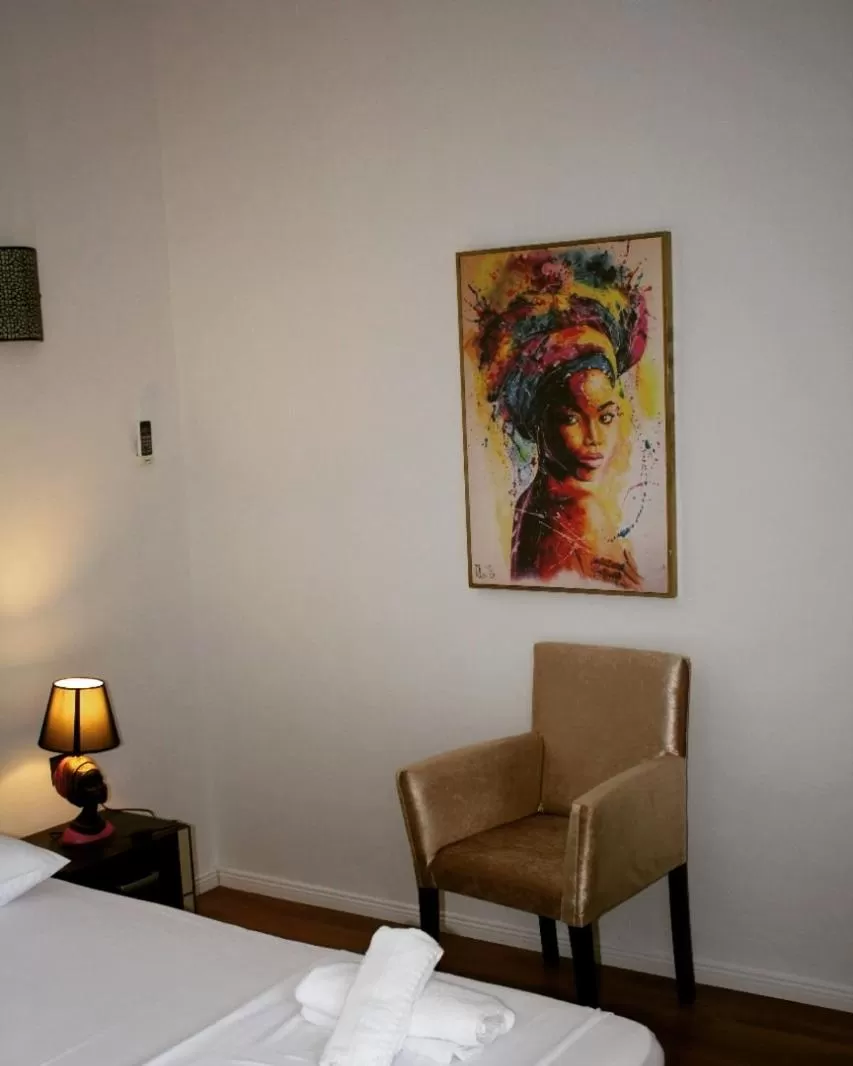 Bed in Hotel Ambasador Garden