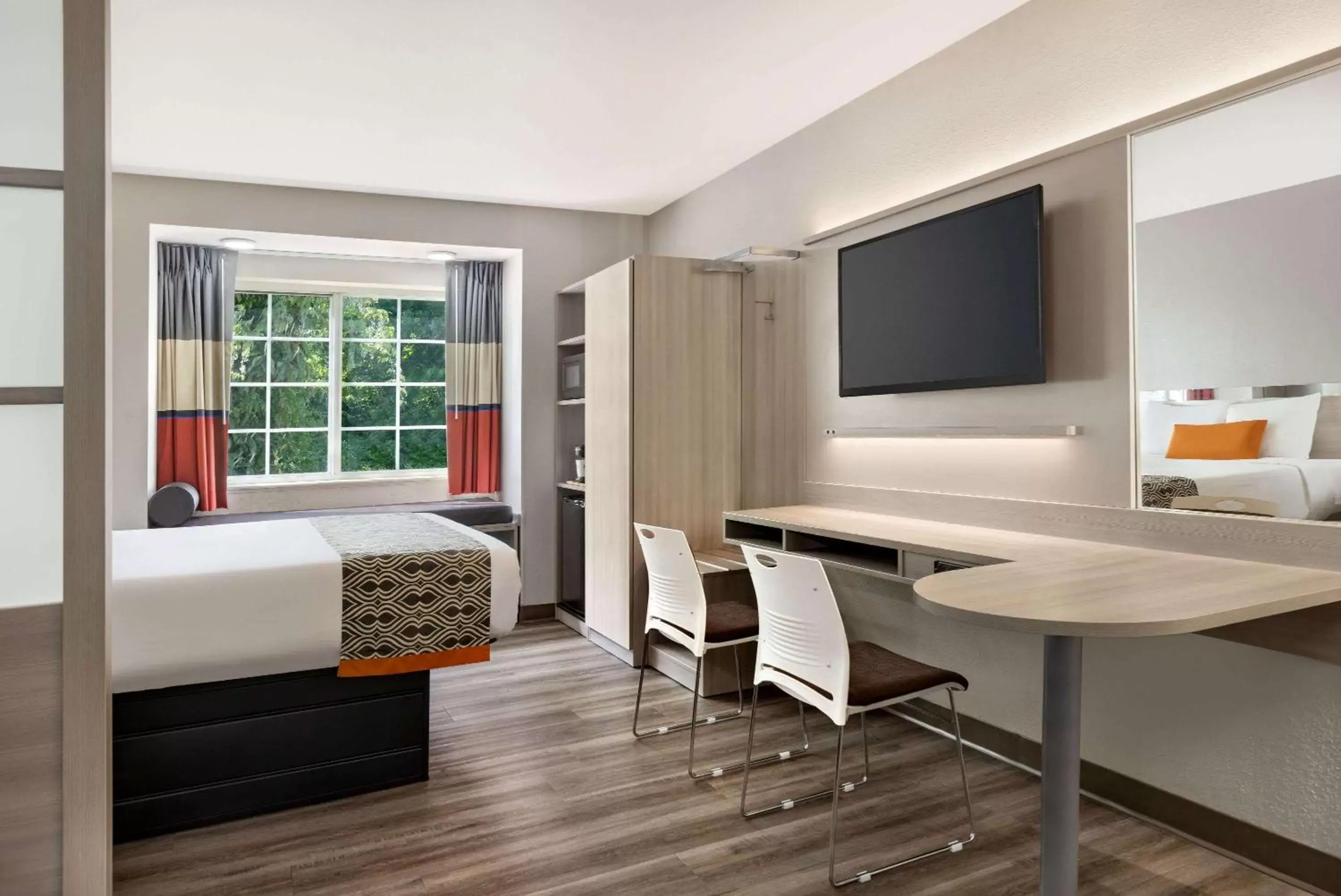 Photo of the whole room, TV/Entertainment Center in Microtel Inn & Suites by Wyndham Raleigh