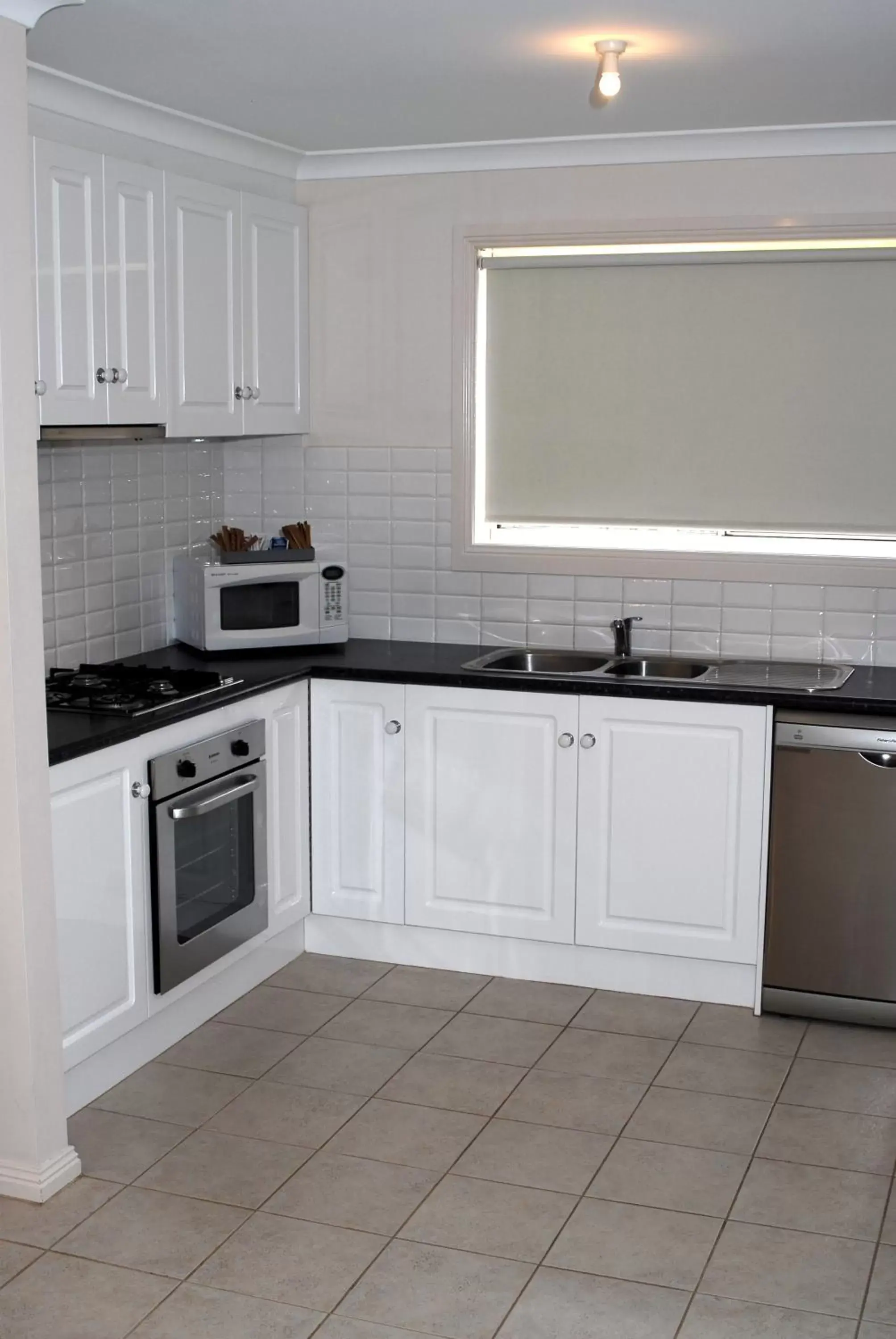 Kitchen or kitchenette, Kitchen/Kitchenette in Melton Motor Inn and Apartments