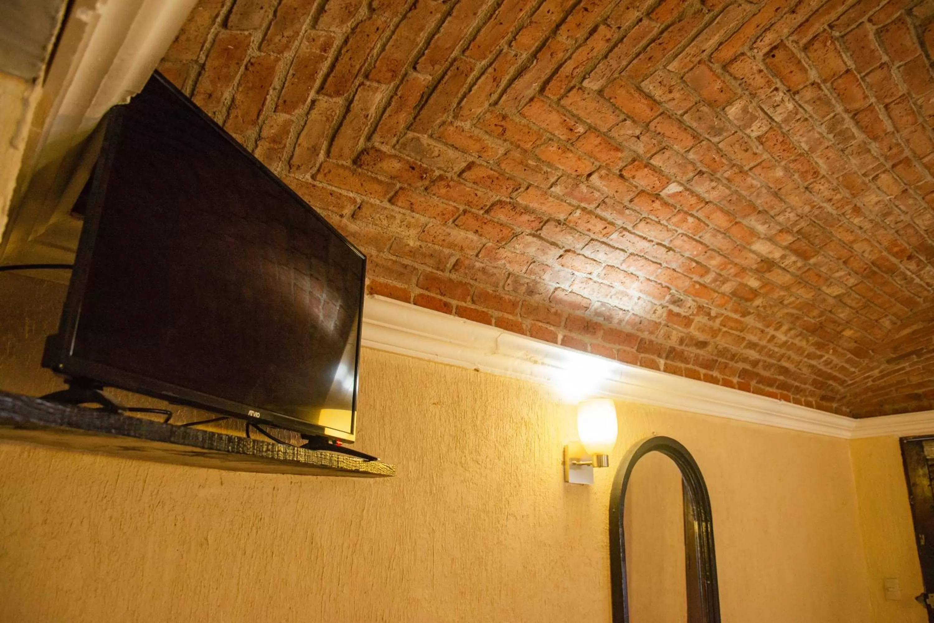 TV and multimedia, TV/Entertainment Center in Hotel Hacienda de Cobos