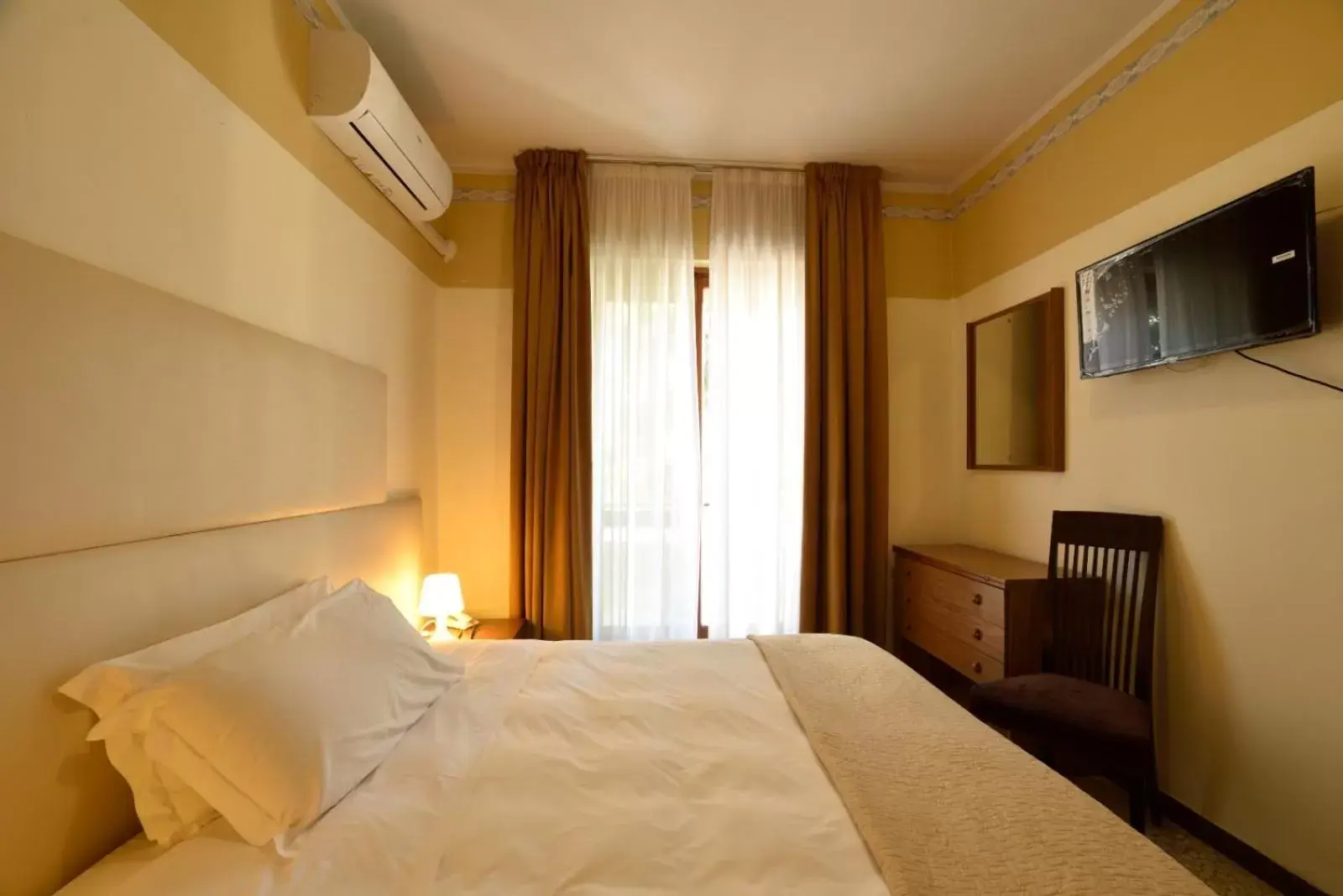 Photo of the whole room, Bed in Hotel Diano Marina Mhotelsgroup