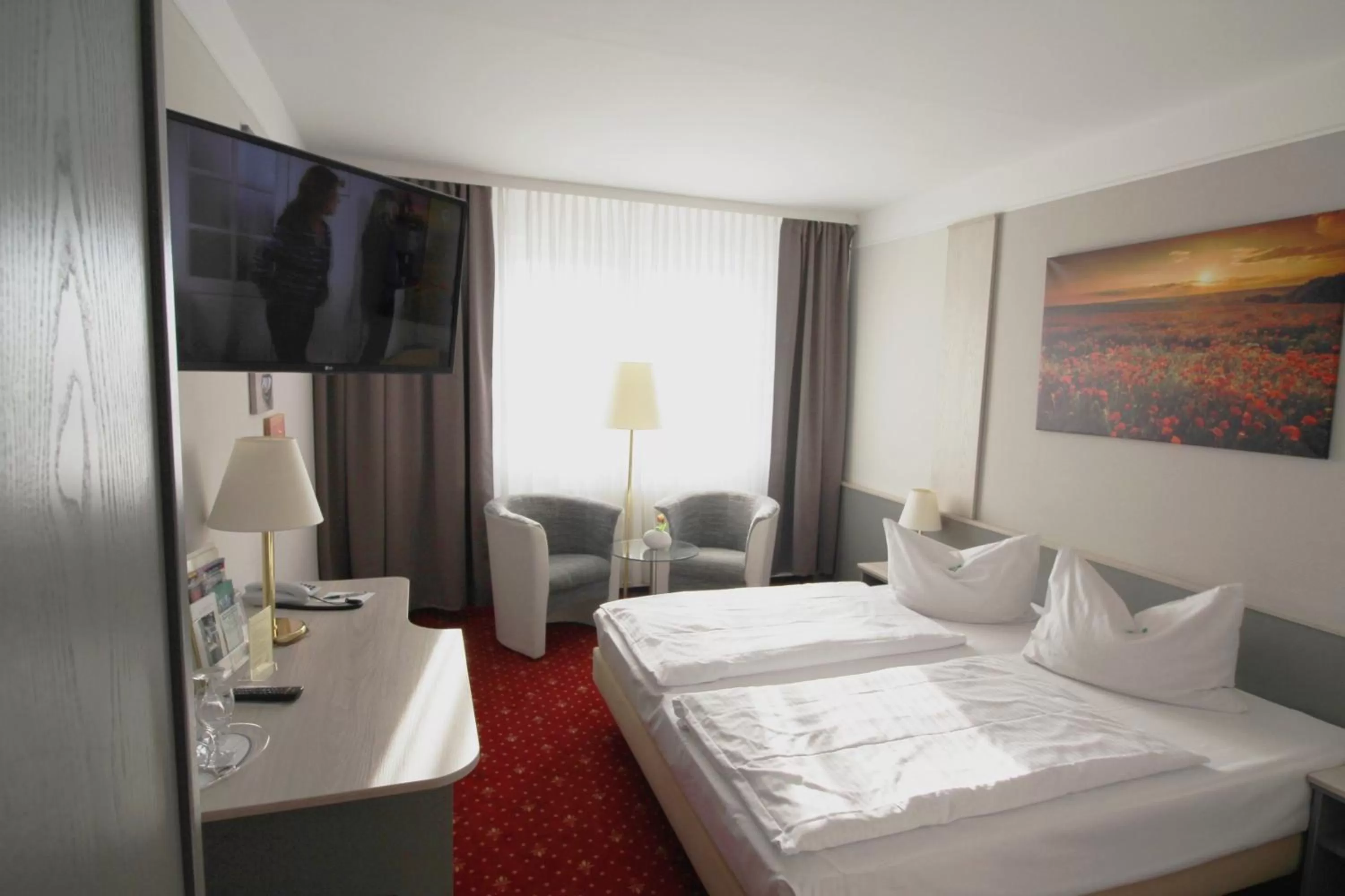 Photo of the whole room, Bed in Parkhotel Klüschenberg