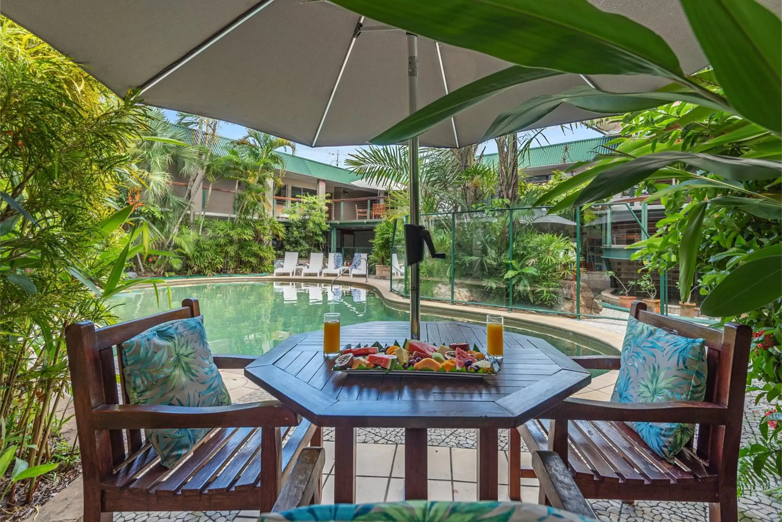 Dining area, Swimming Pool in Bay Village Tropical Retreat & Apartments