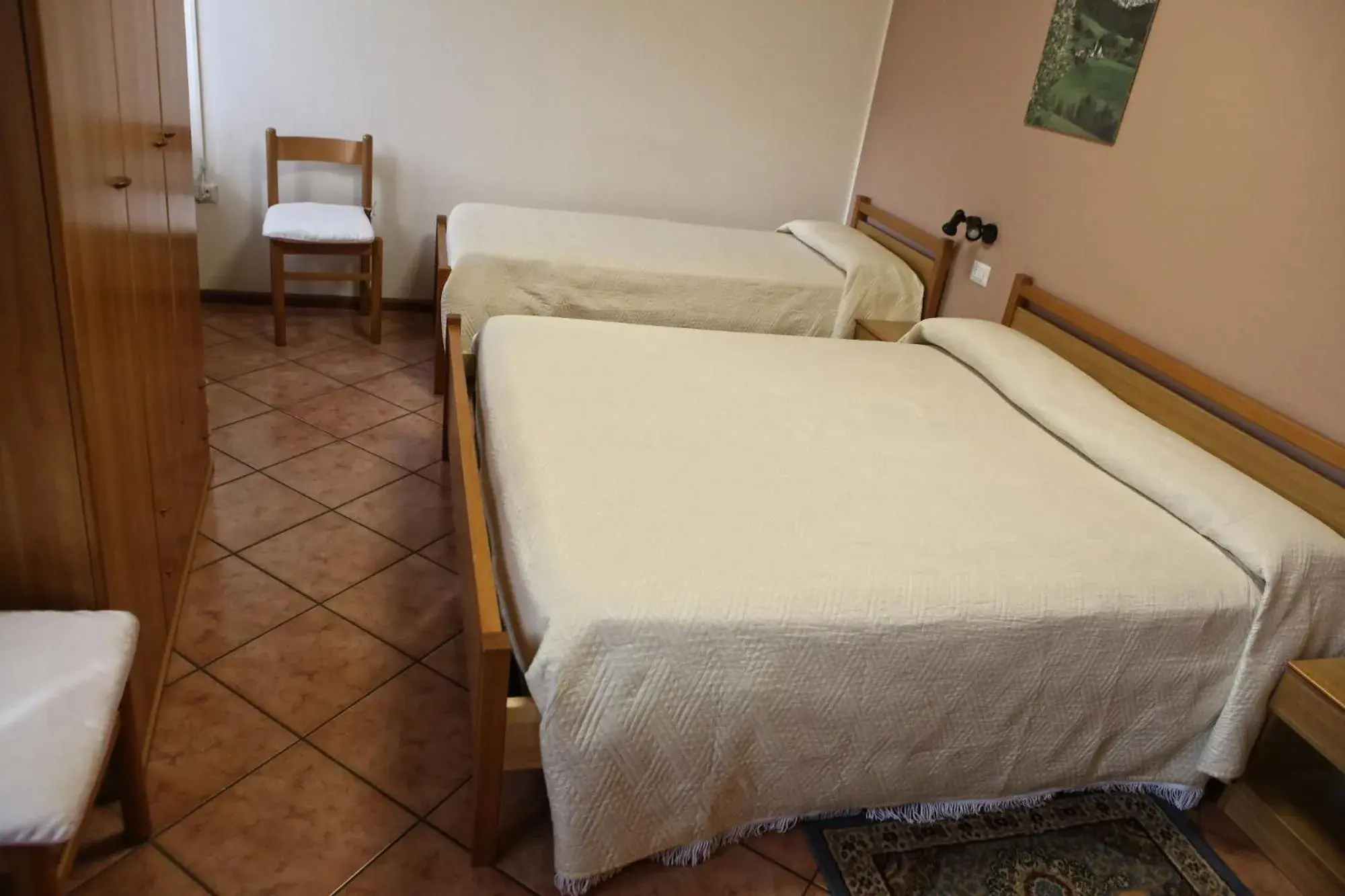 Bed in Albergo Gusmeroli