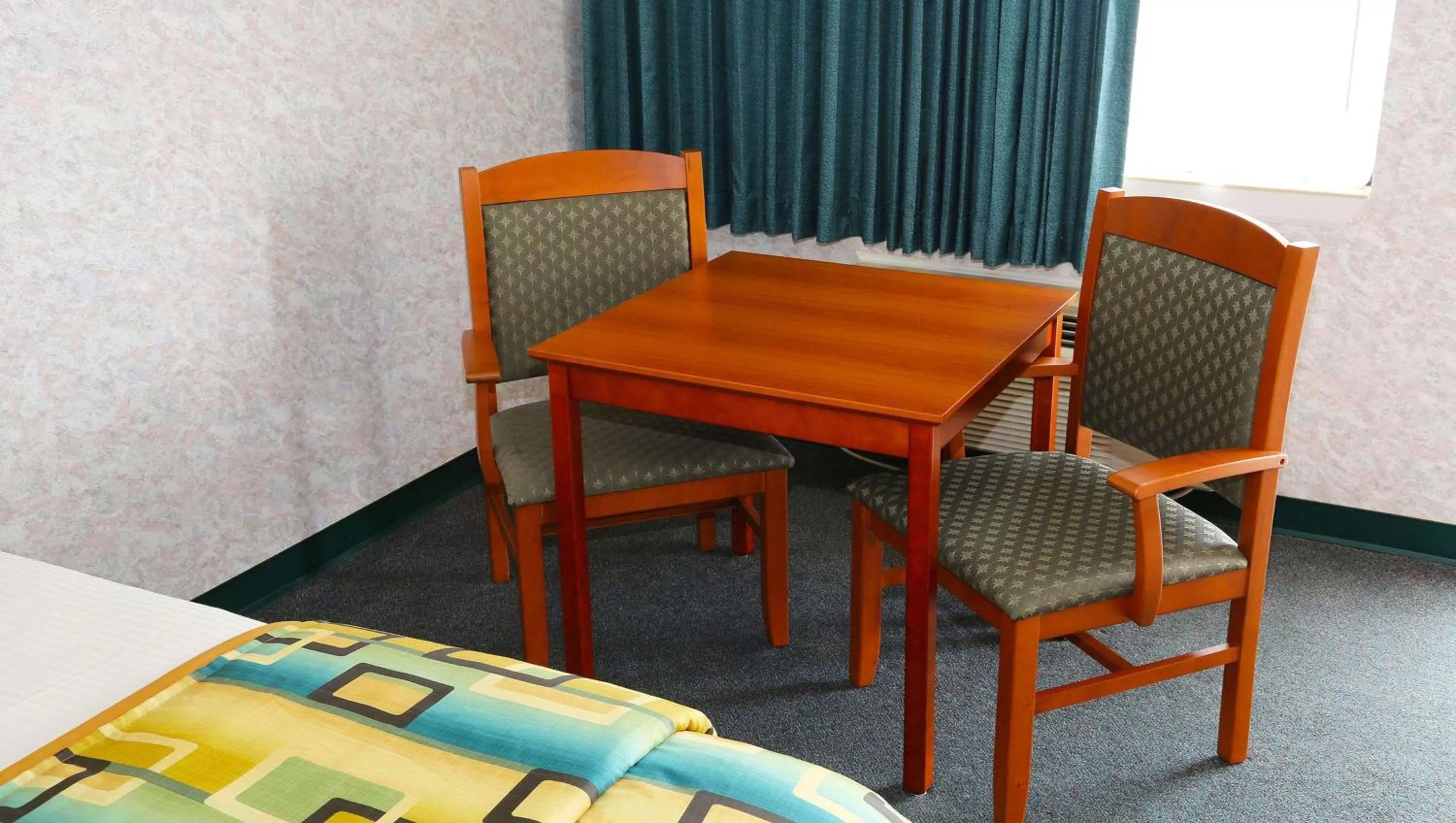 Photo of the whole room in Magnuson Hotel Howell/Brighton