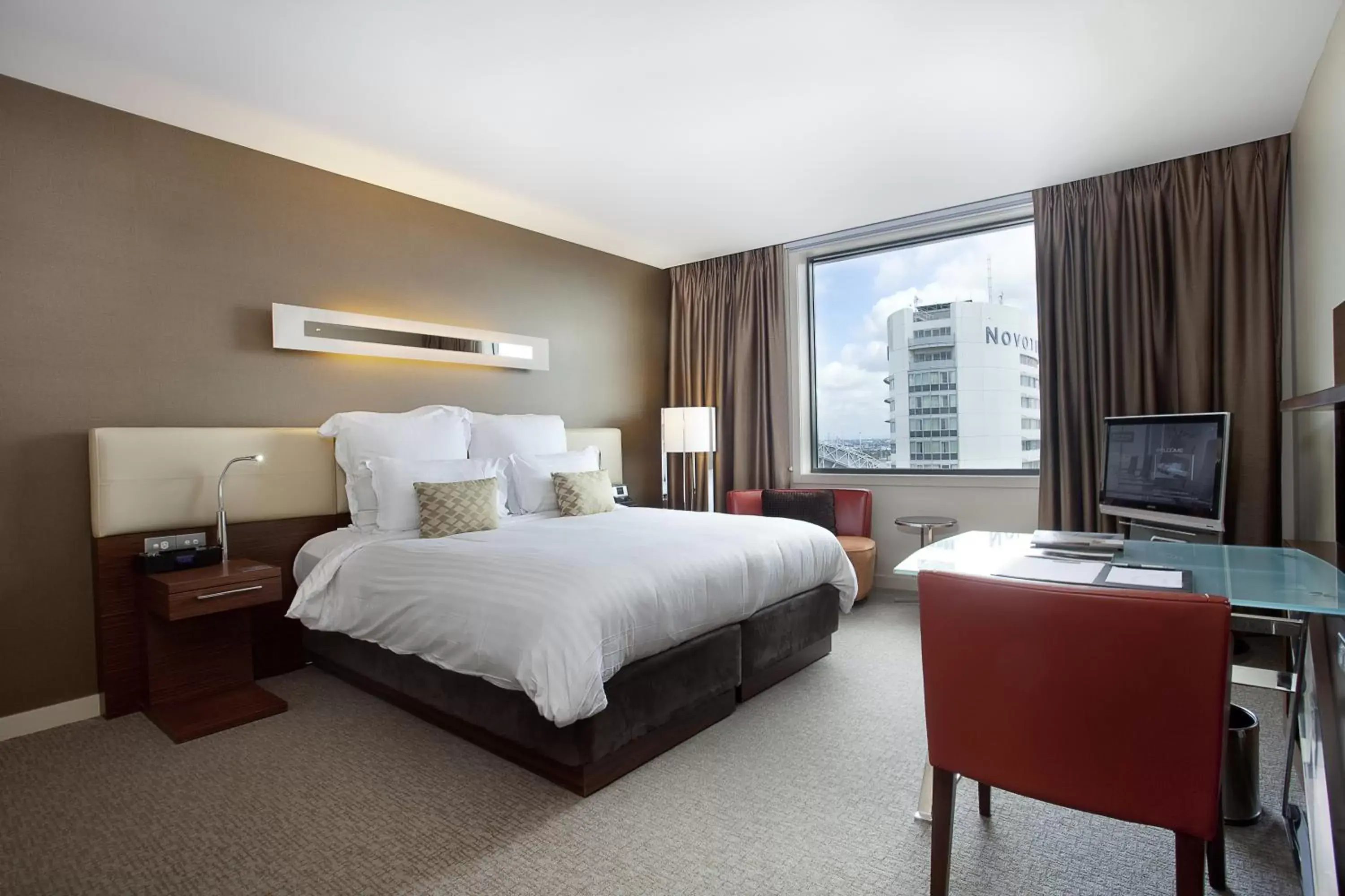 Bed in Pullman at Sydney Olympic Park Hotel