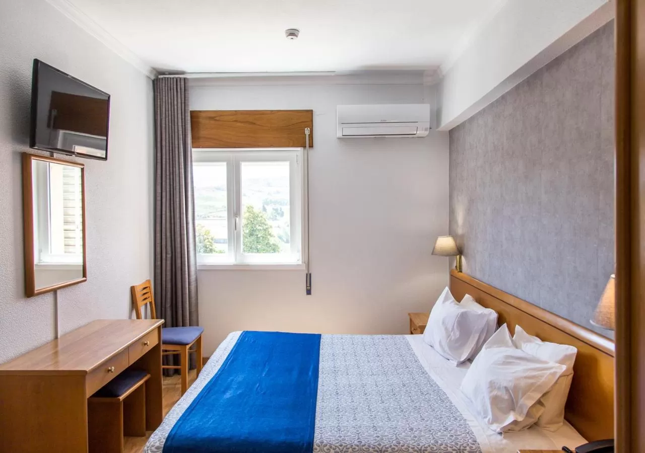 Bed in Hotel Columbano