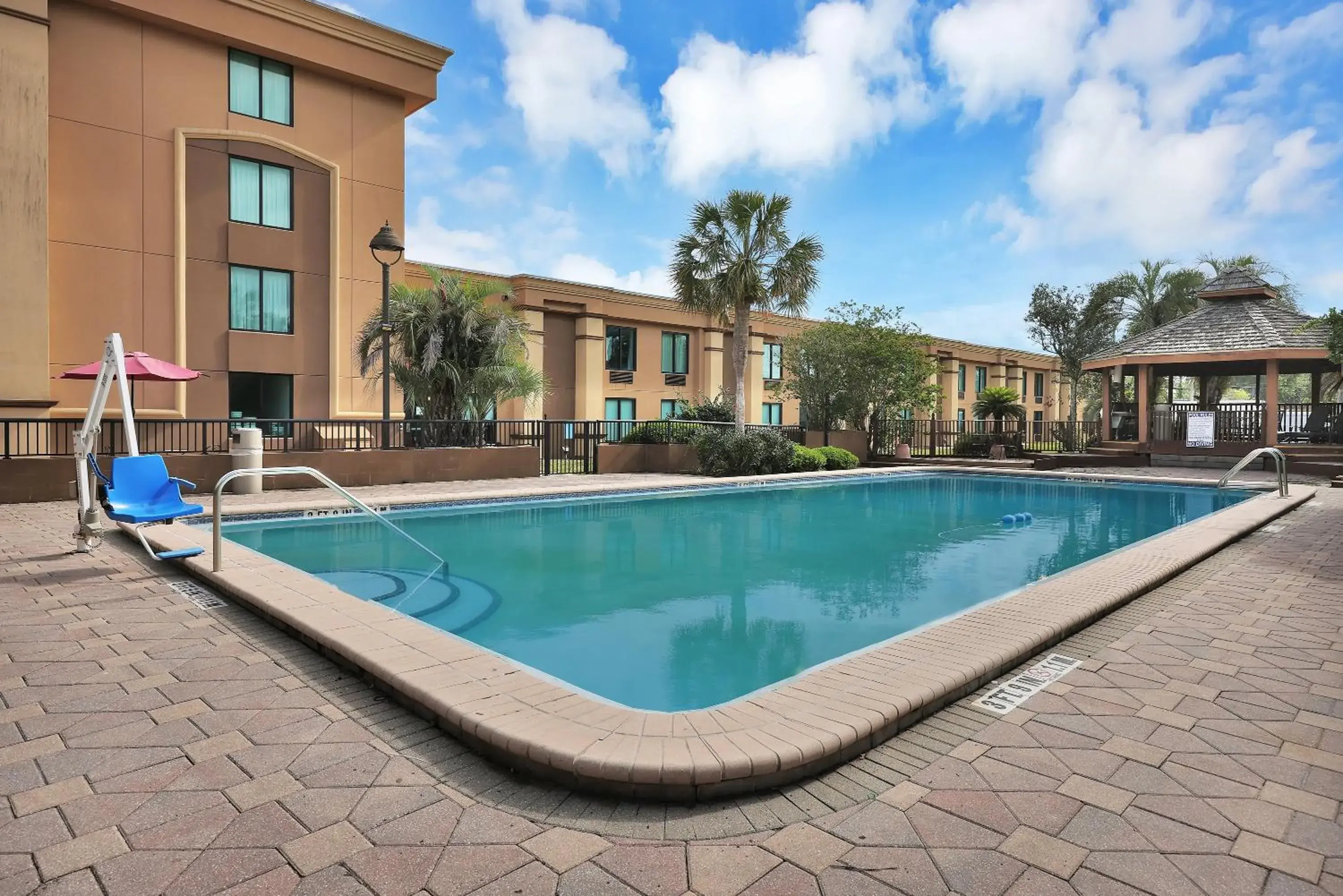 Swimming Pool in Ramada by Wyndham Jacksonville I-95 by Butler Blvd