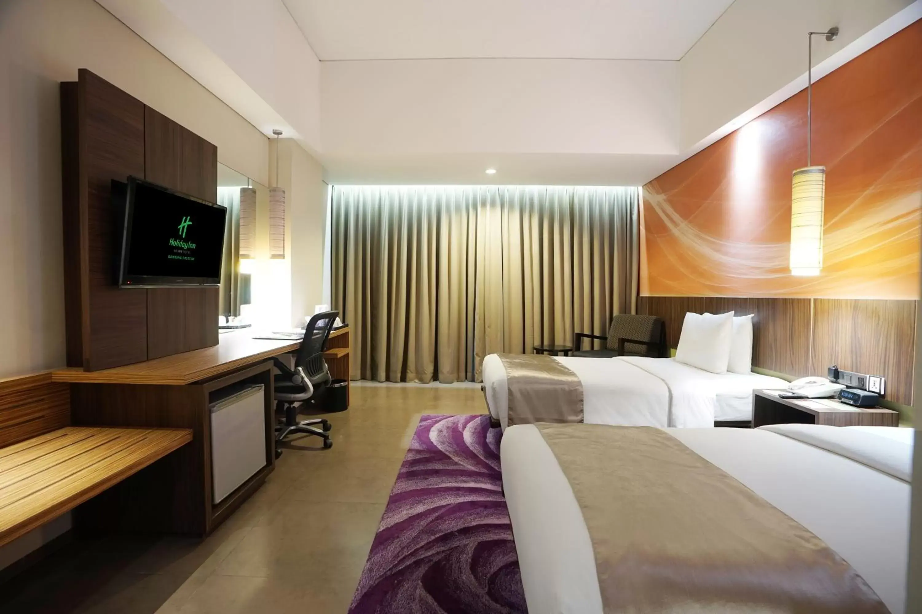 Bed in Holiday Inn Bandung Pasteur, an IHG Hotel