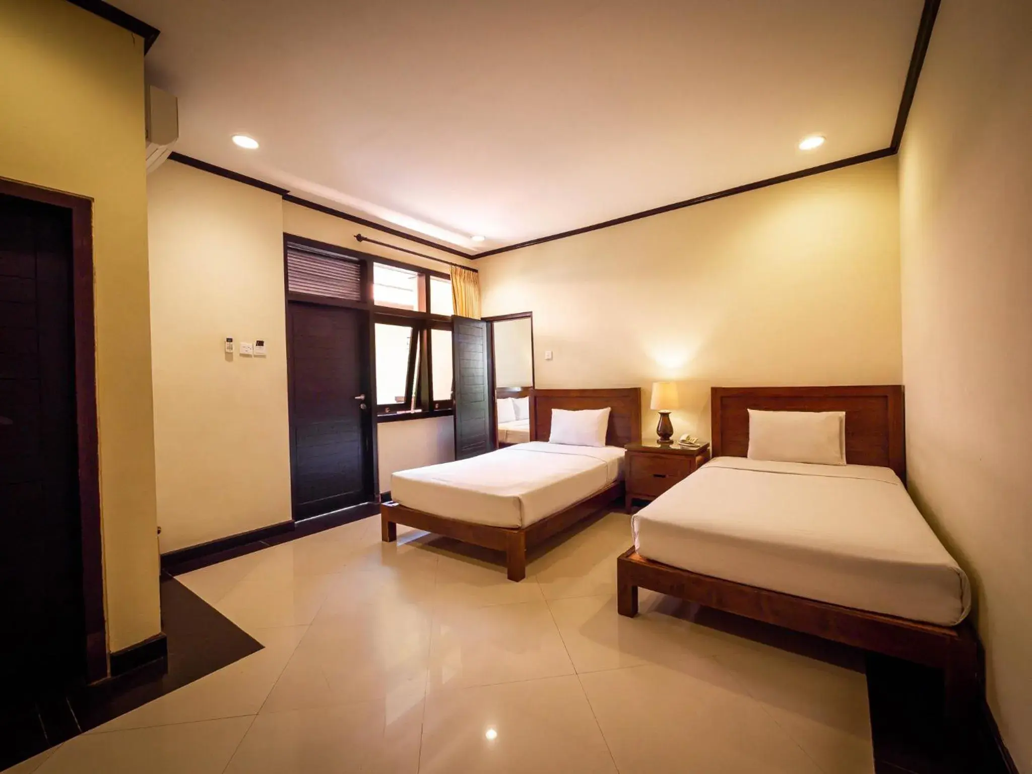 Toilet, Bed in Yulia Beach Inn Kuta