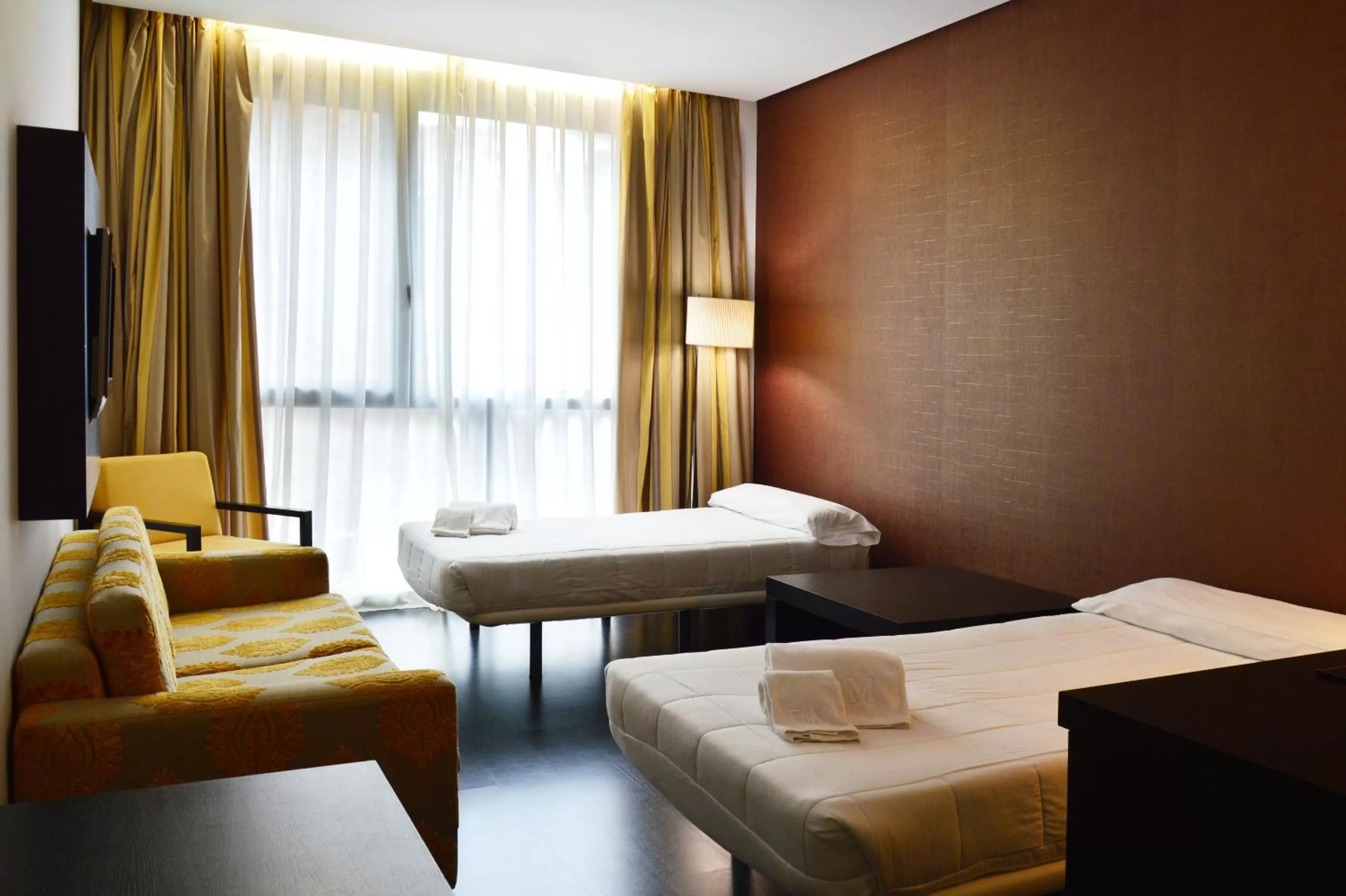 Living room, Bed in Gran Hotel Don Manuel