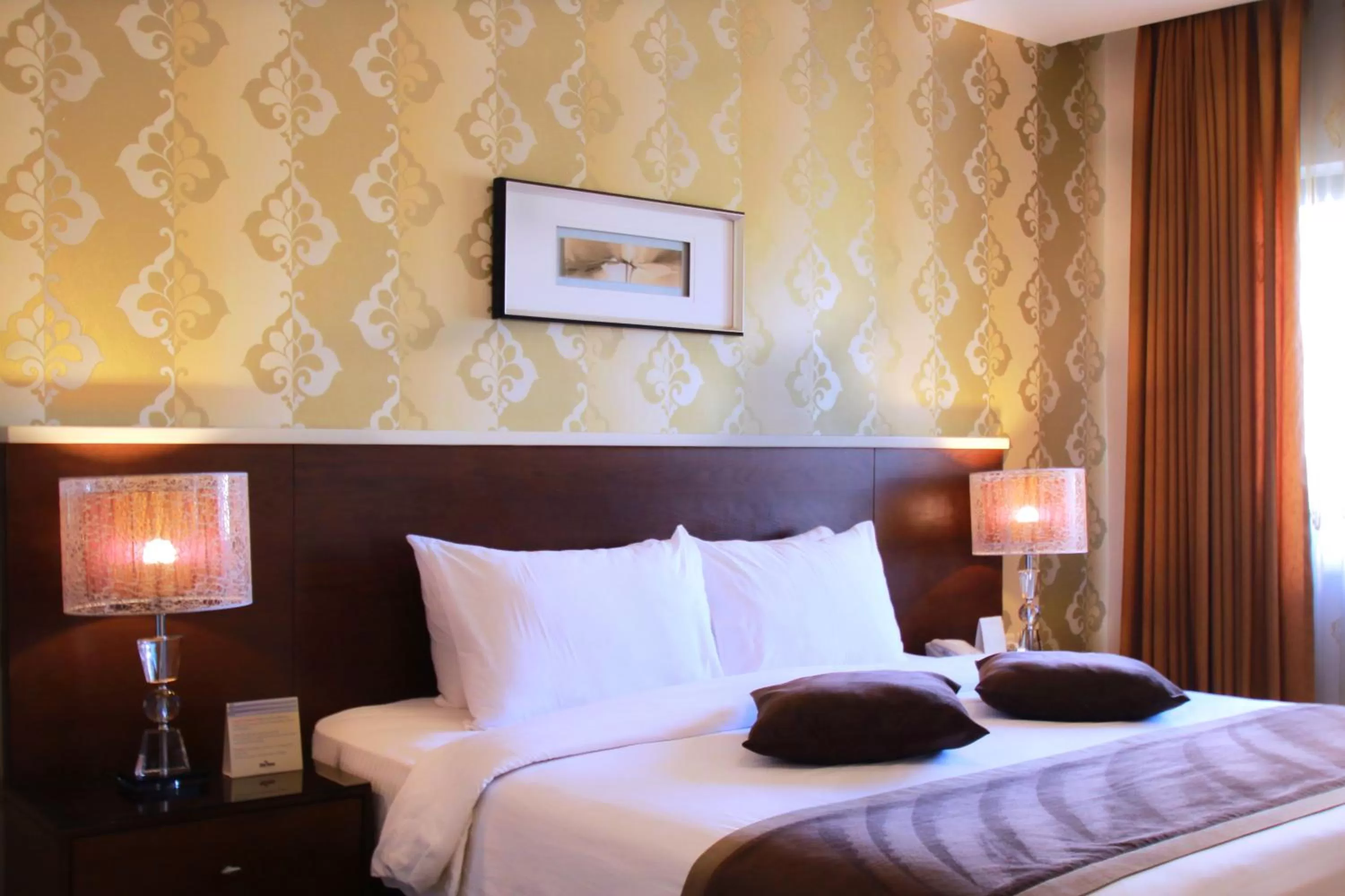 Bed in City Rose Hotel Suites