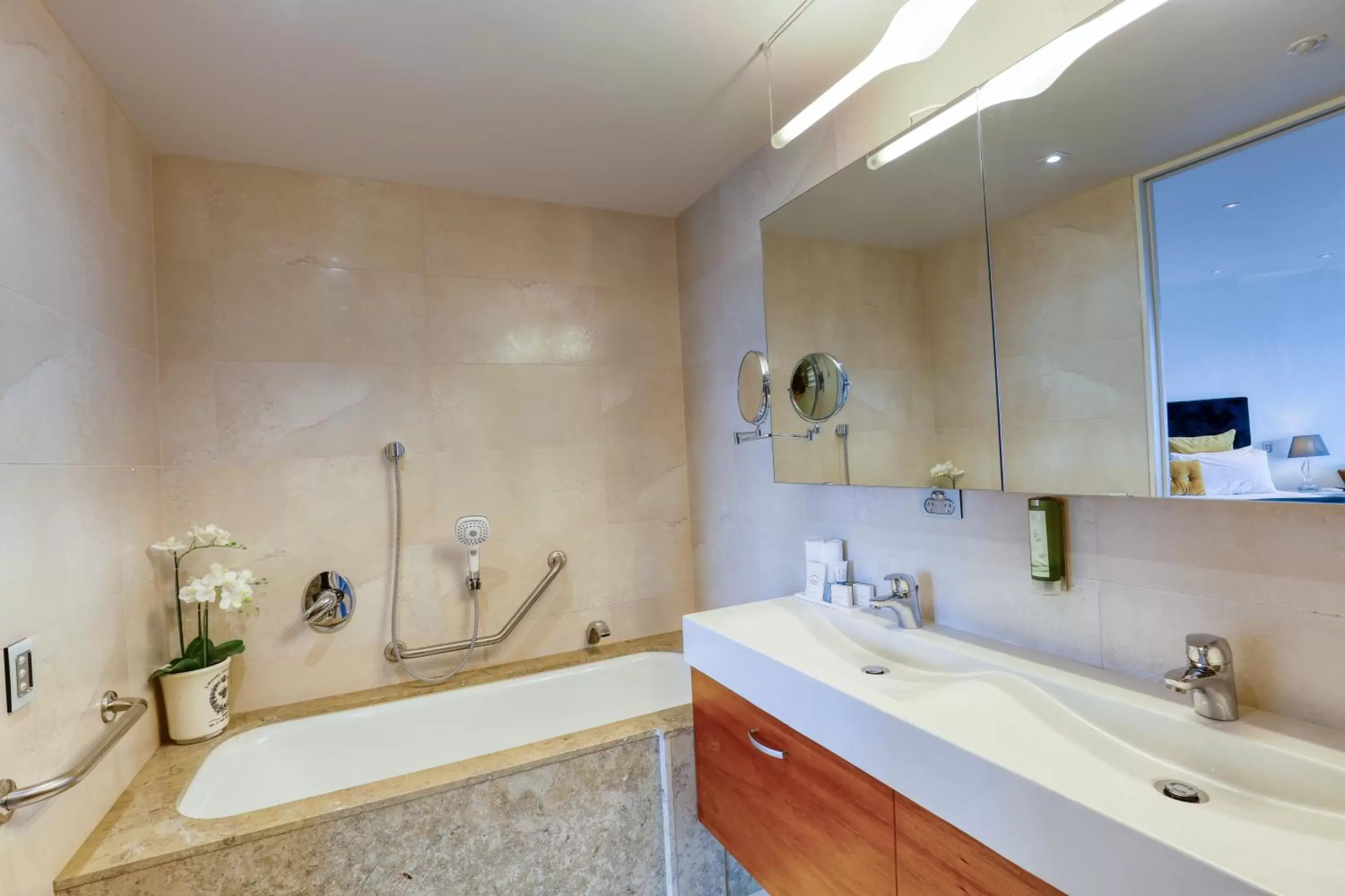 Bathroom in Ramada Suites by Wyndham Nautilus Orewa