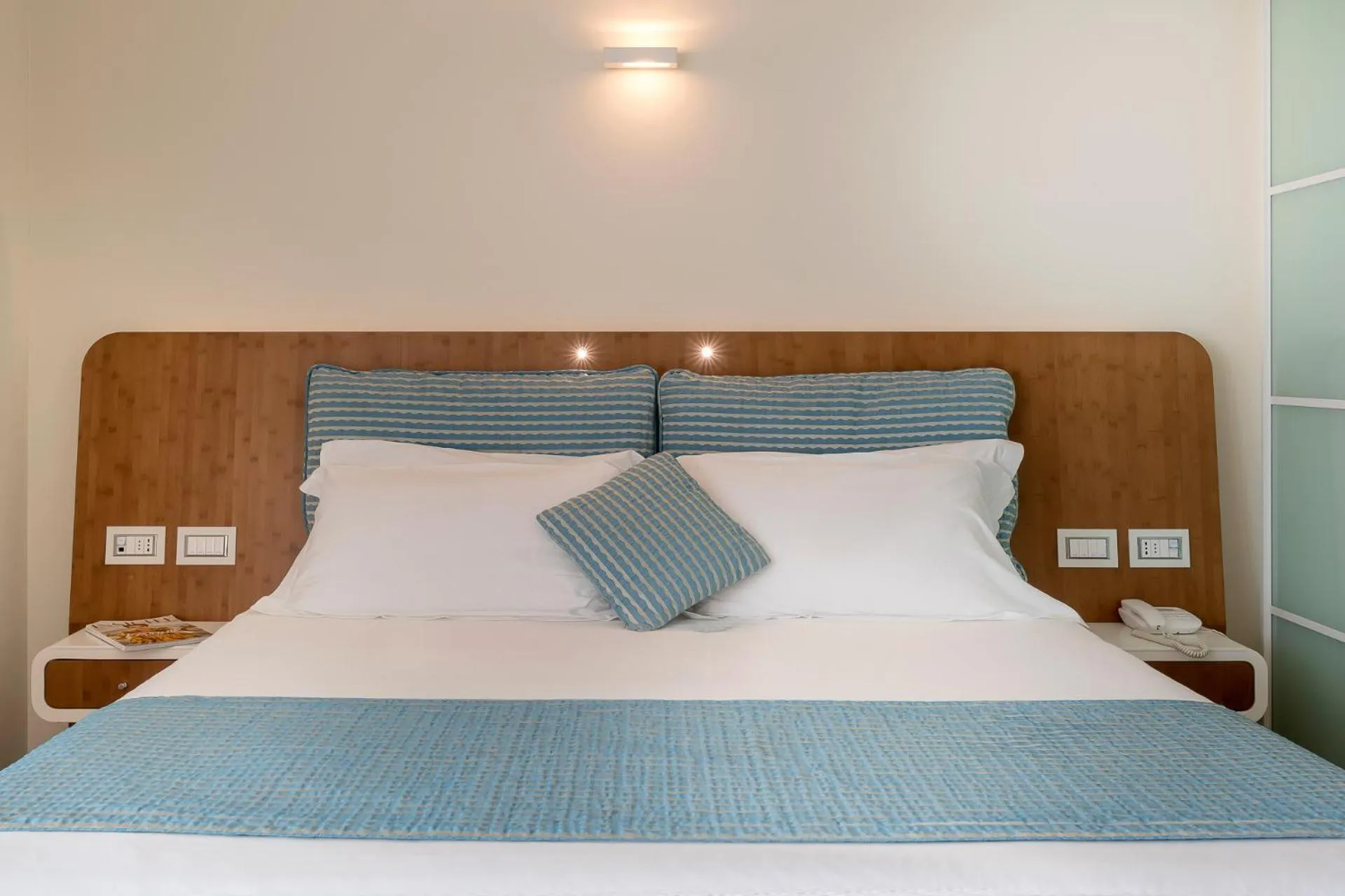 Bed in T-Suite Hotel