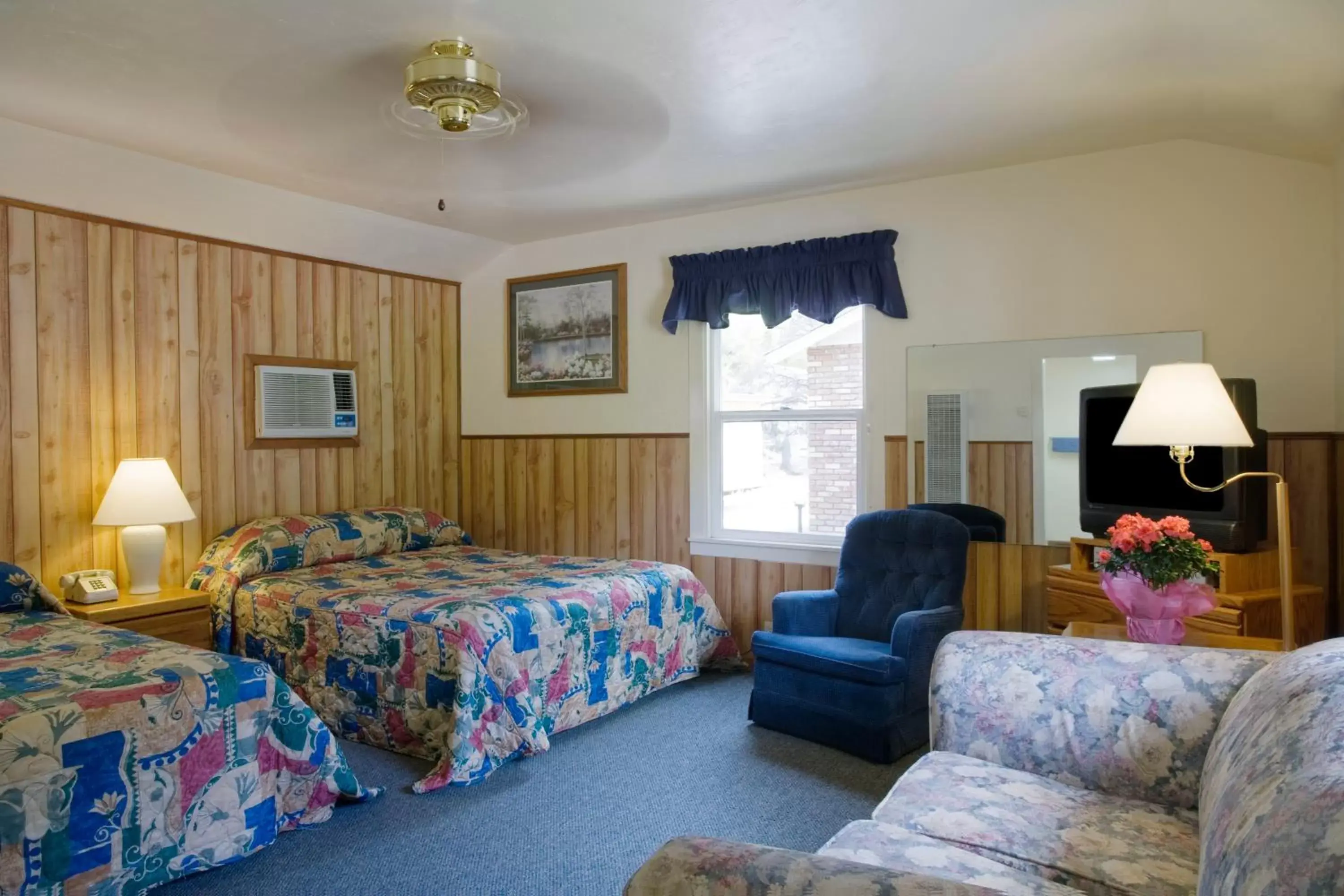 Bed in Lazy J Ranch Motel