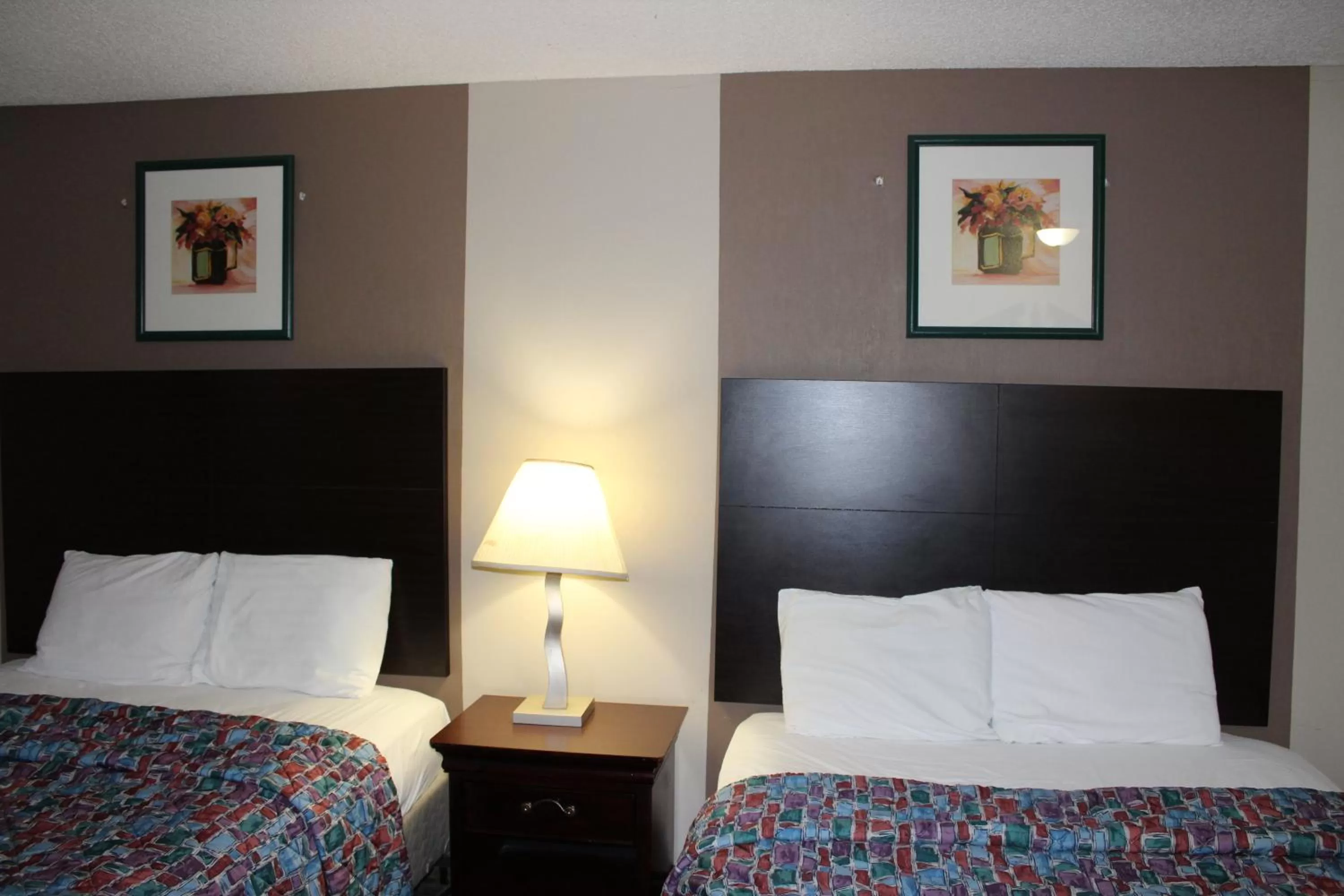Bedroom, Bed in Coratel Inn and Suites Maple Grove