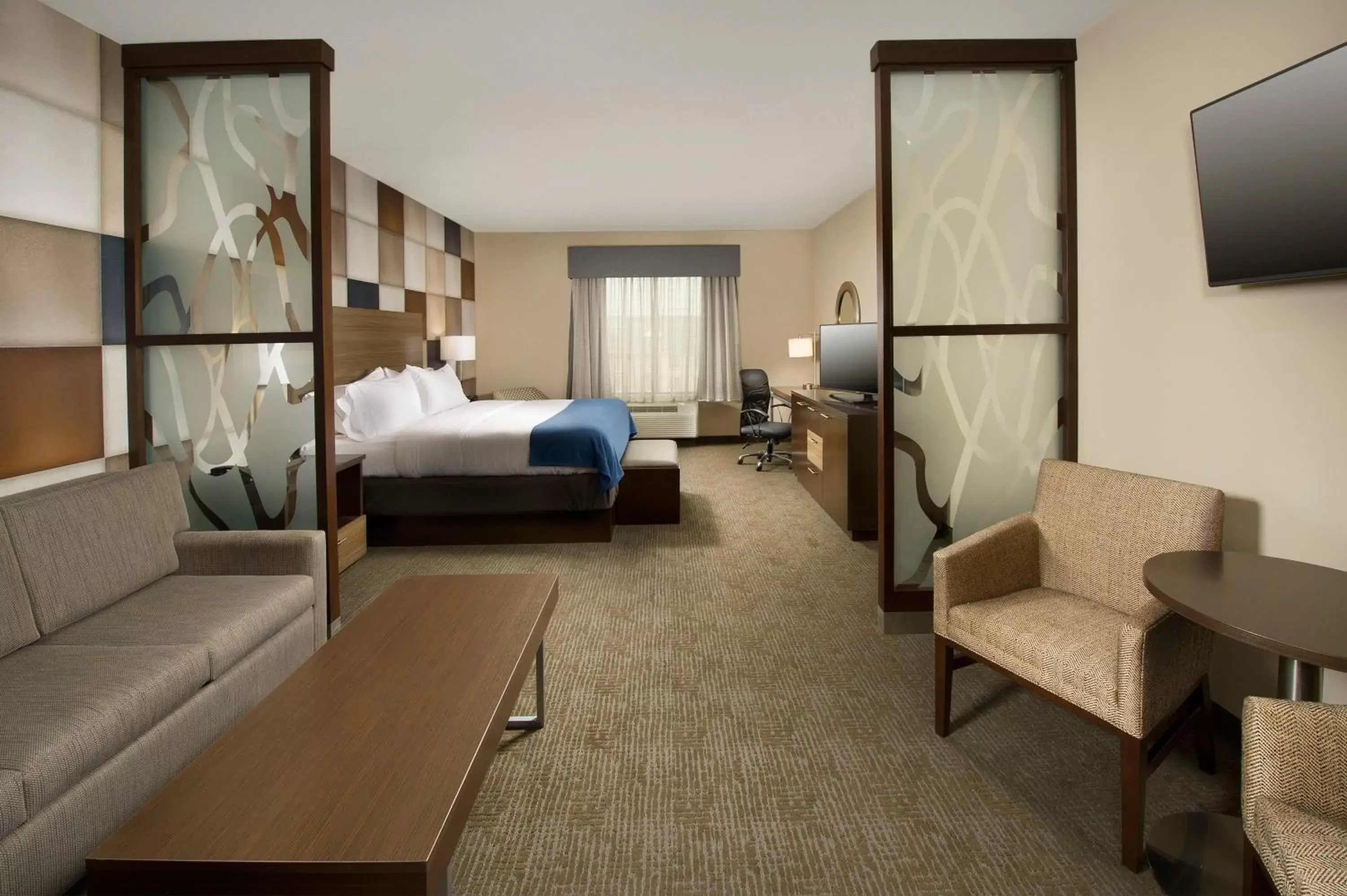 Bedroom, Seating Area in Holiday Inn Express Hotel & Suites Waco South, an IHG Hotel