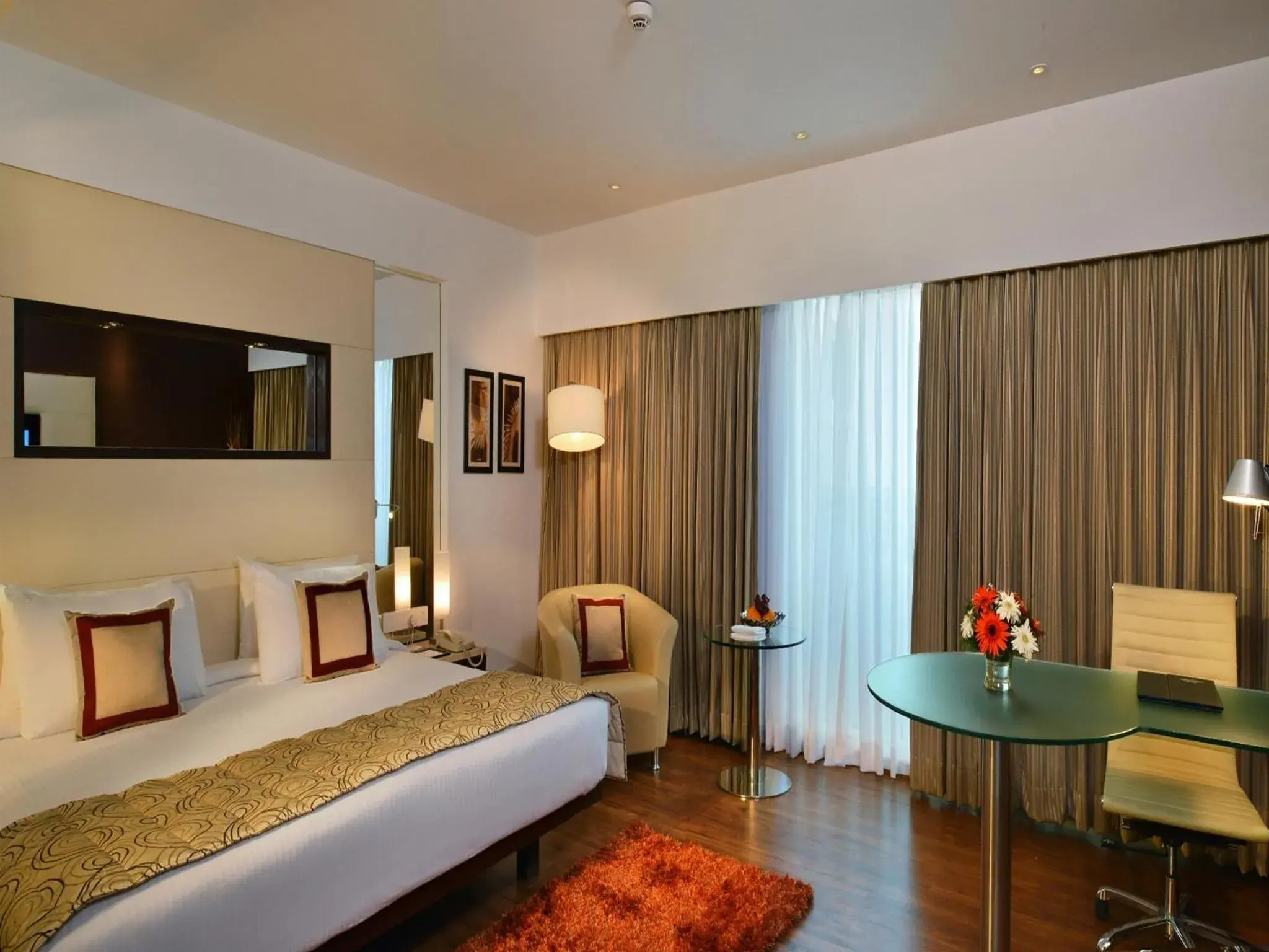 Bed, Seating Area in Majestic Court Sarovar Portico