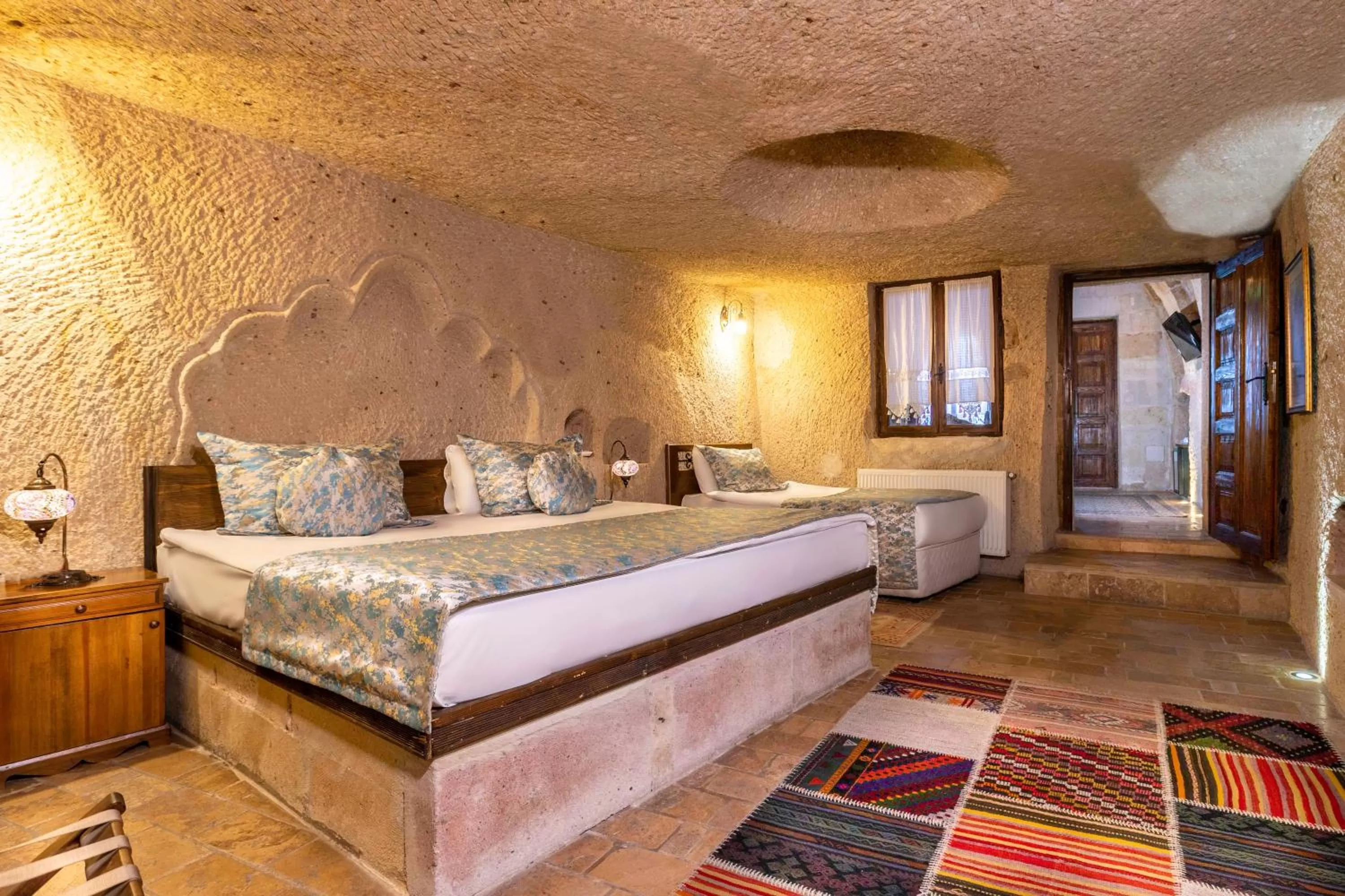 Bed in Adora Cave Suites -