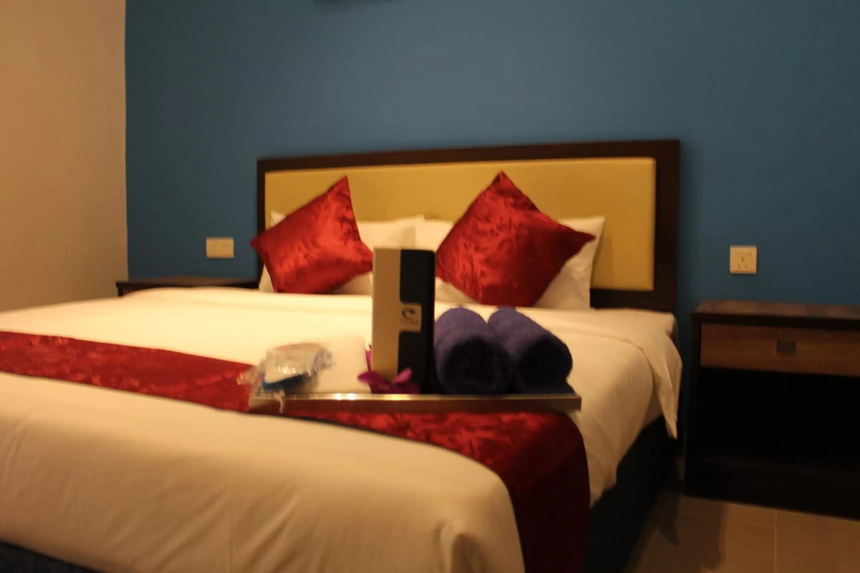 Bed in Royal Agate Beach Resort