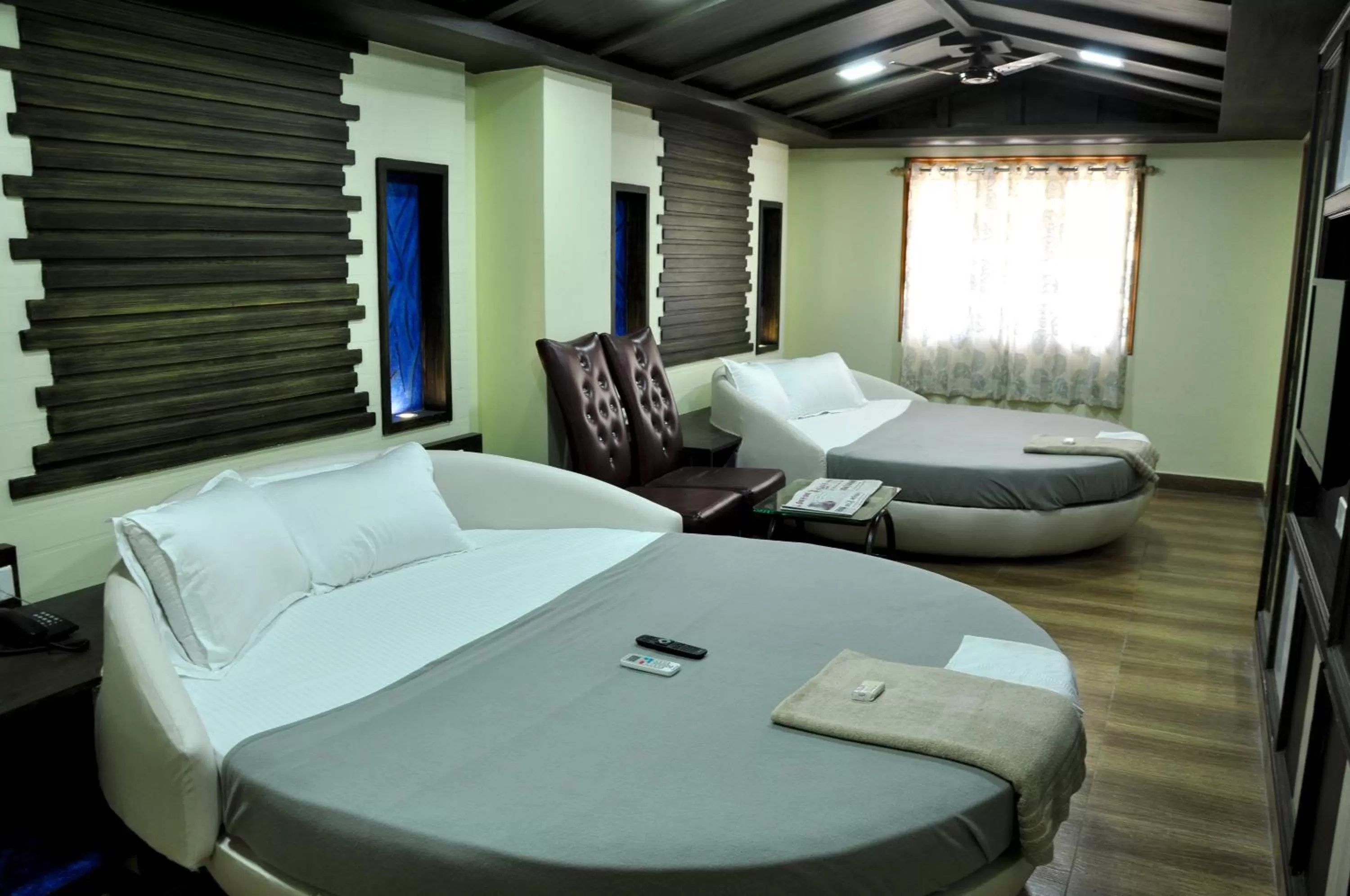 Bed in Hotel Anandhiram Heritage