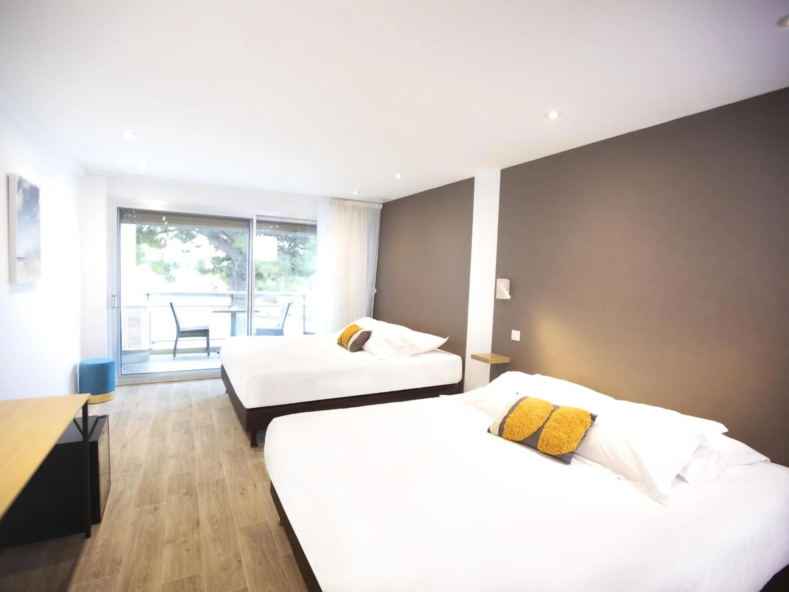 Bed in Tiercé Hotel