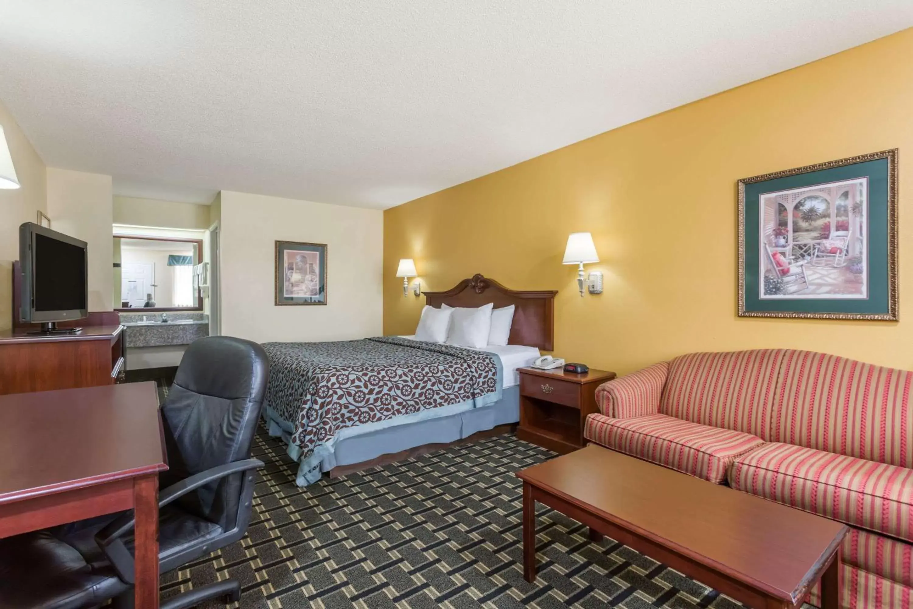 Photo of the whole room in Days Inn & Suites by Wyndham Warner Robins Near Robins AFB