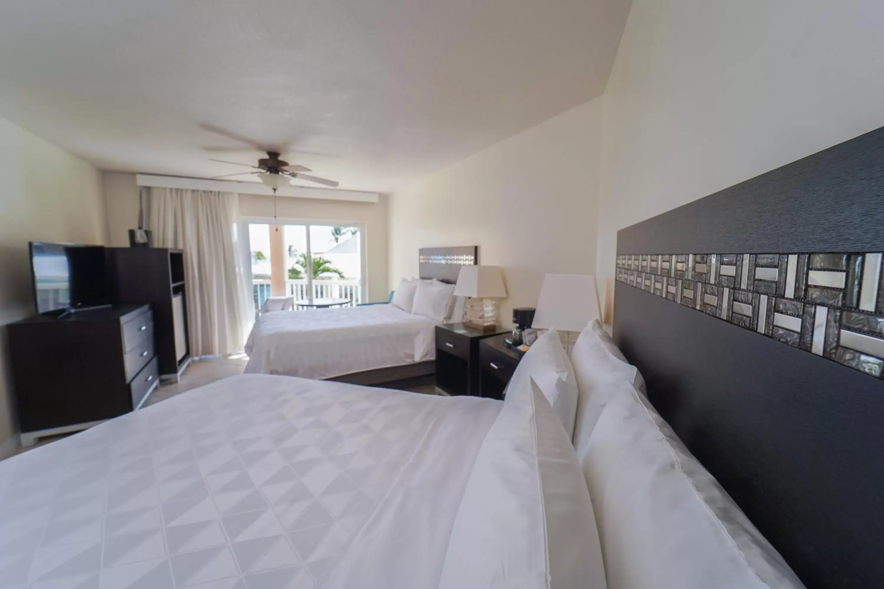 Bedroom in Holiday Inn Resort Grand Cayman, an IHG Hotel
