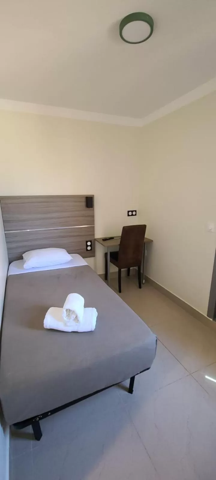 Bed in ESPERANCE HOTEL