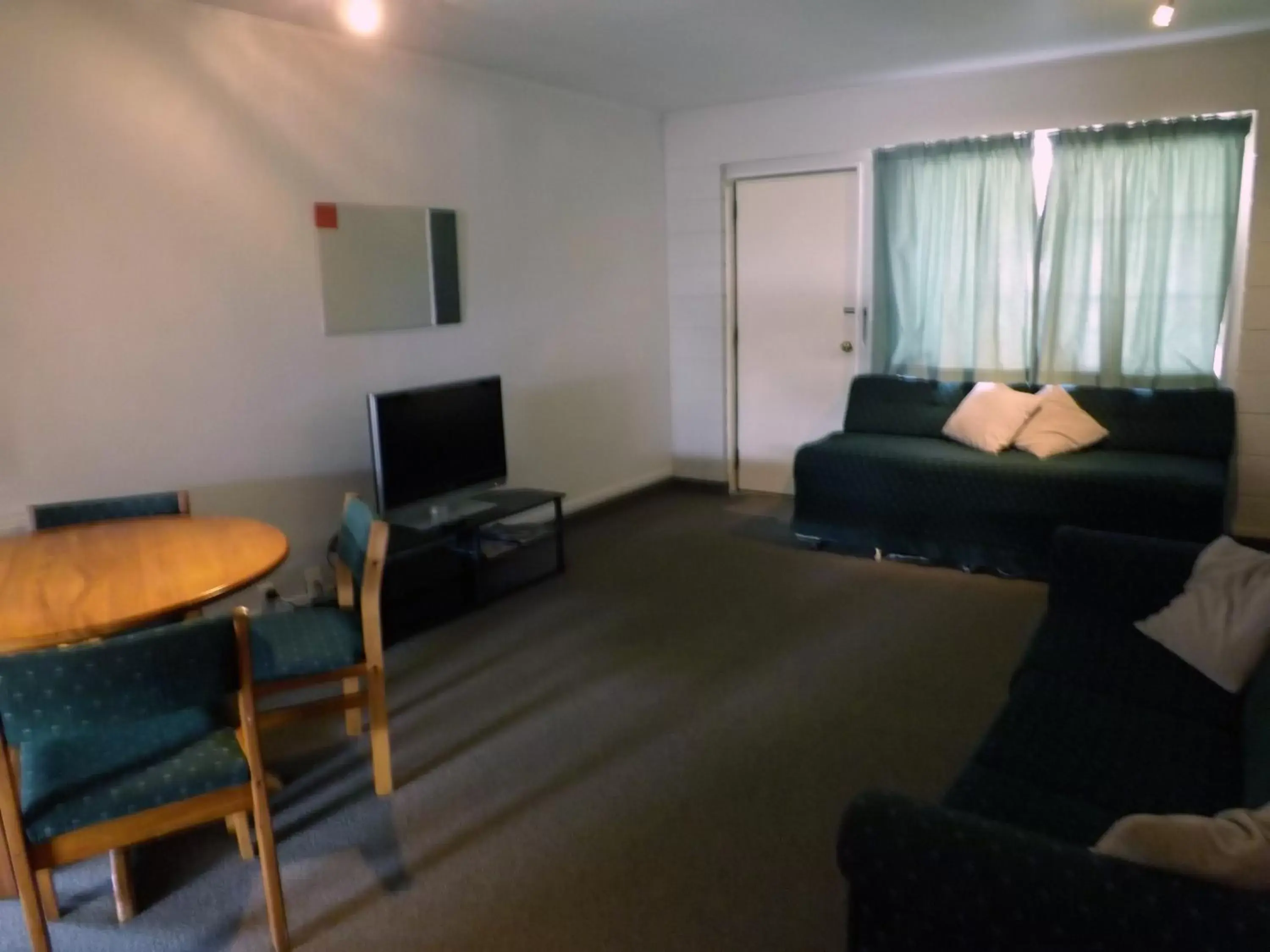 Photo of the whole room, Seating Area in Karaka Tree Motel