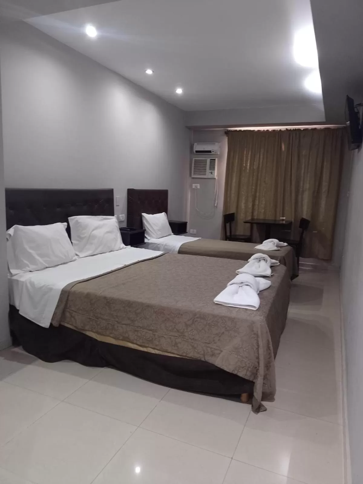 Bed in Lorenzo Suites Hotel