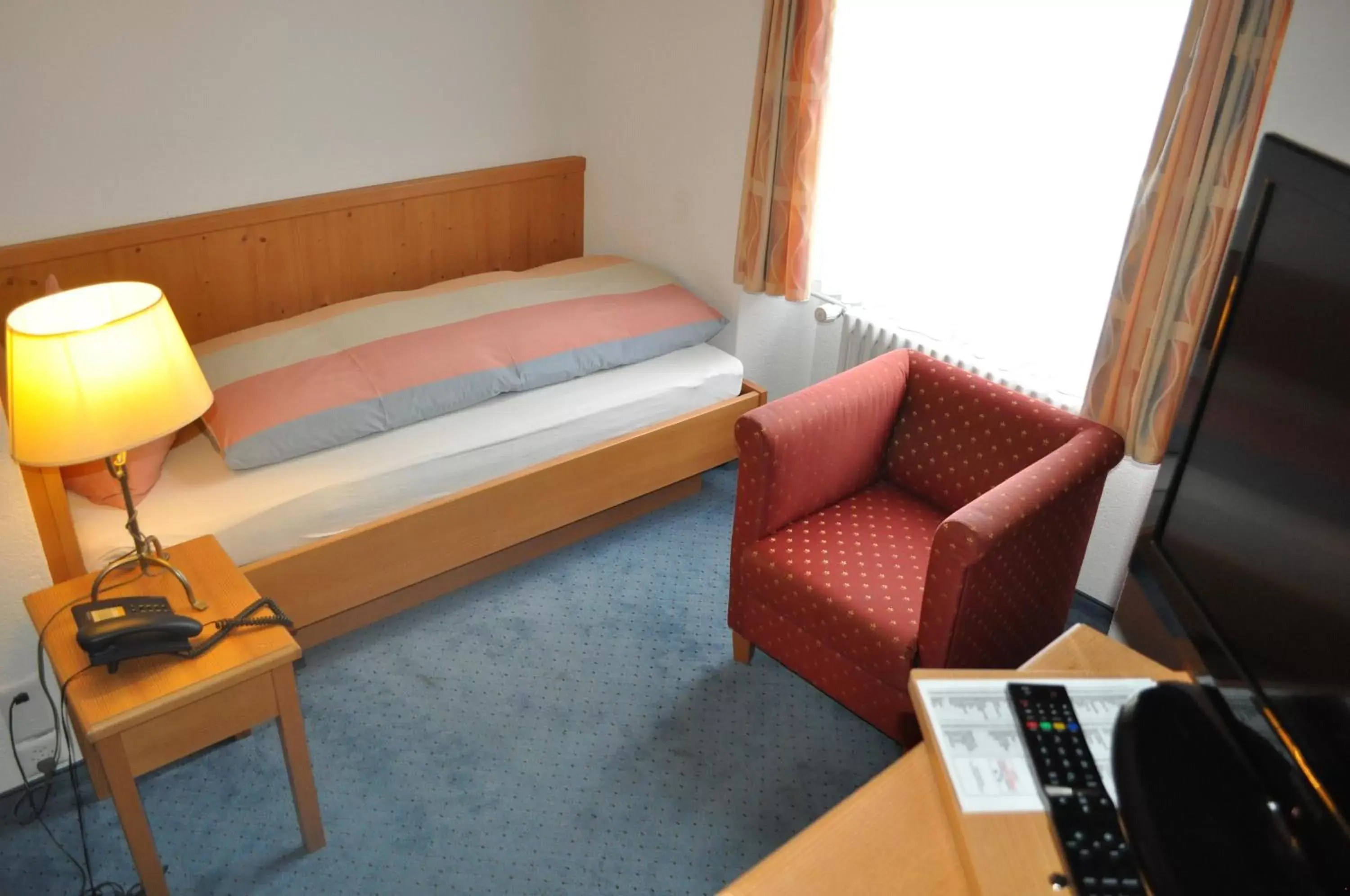 Bed, Seating Area in Hotel Engelberg "das Trail Hotel"