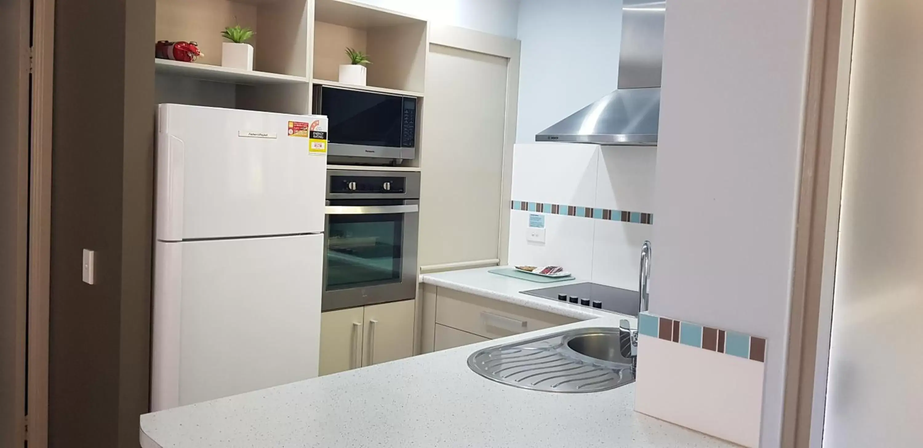 Kitchen/Kitchenette in Korora Bay Village Resort