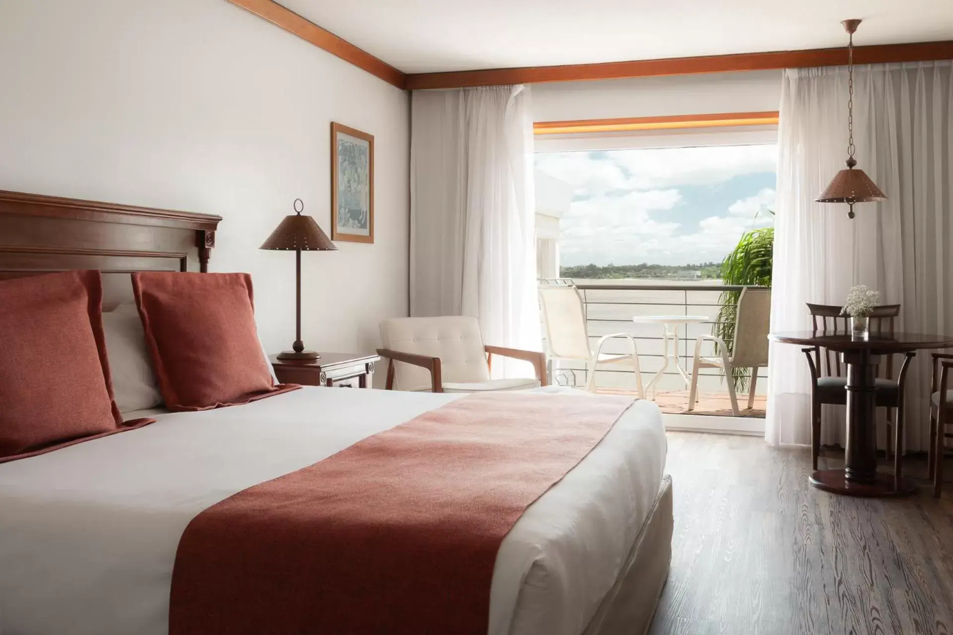 River view, Bed in Radisson Colonia Del Sacramento Hotel