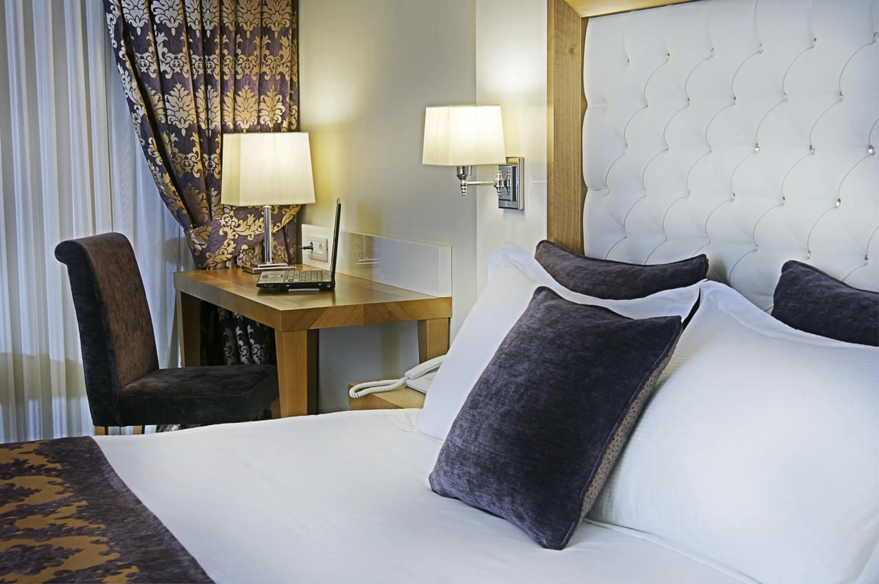 Bed in Tugcu Hotel Select