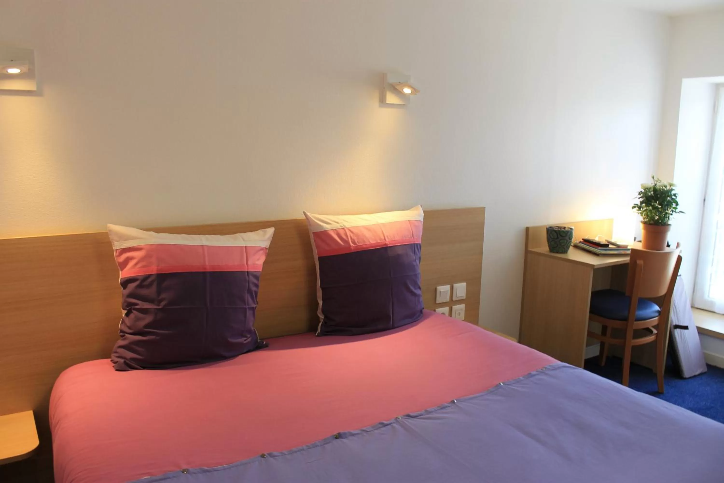 Bed in Hôtel du lion d'or