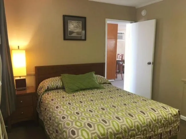 Bed in Polynesian Oceanfront Hotel