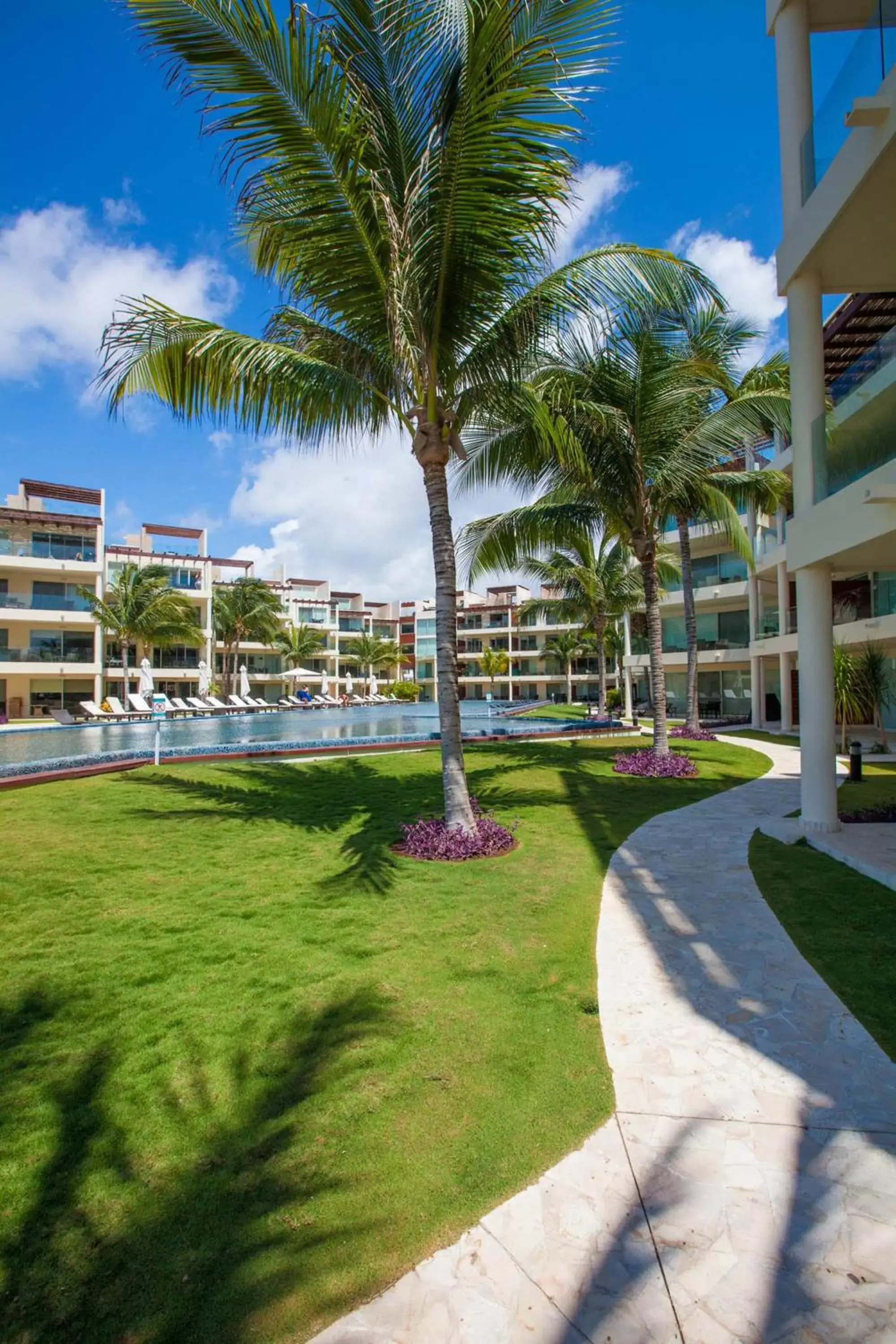 Swimming pool, Property Building in The Elements Oceanfront & Beachside Condo Hotel