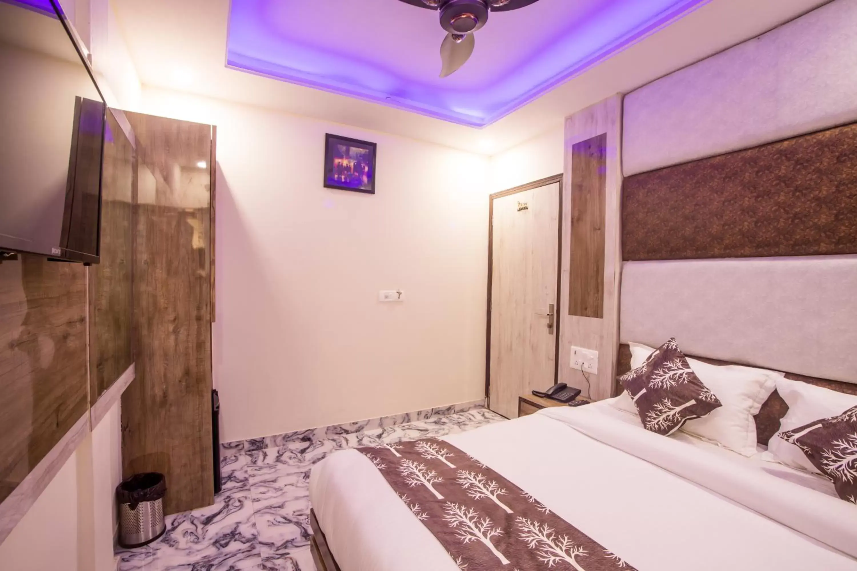 Bed in Hotel Harsha International