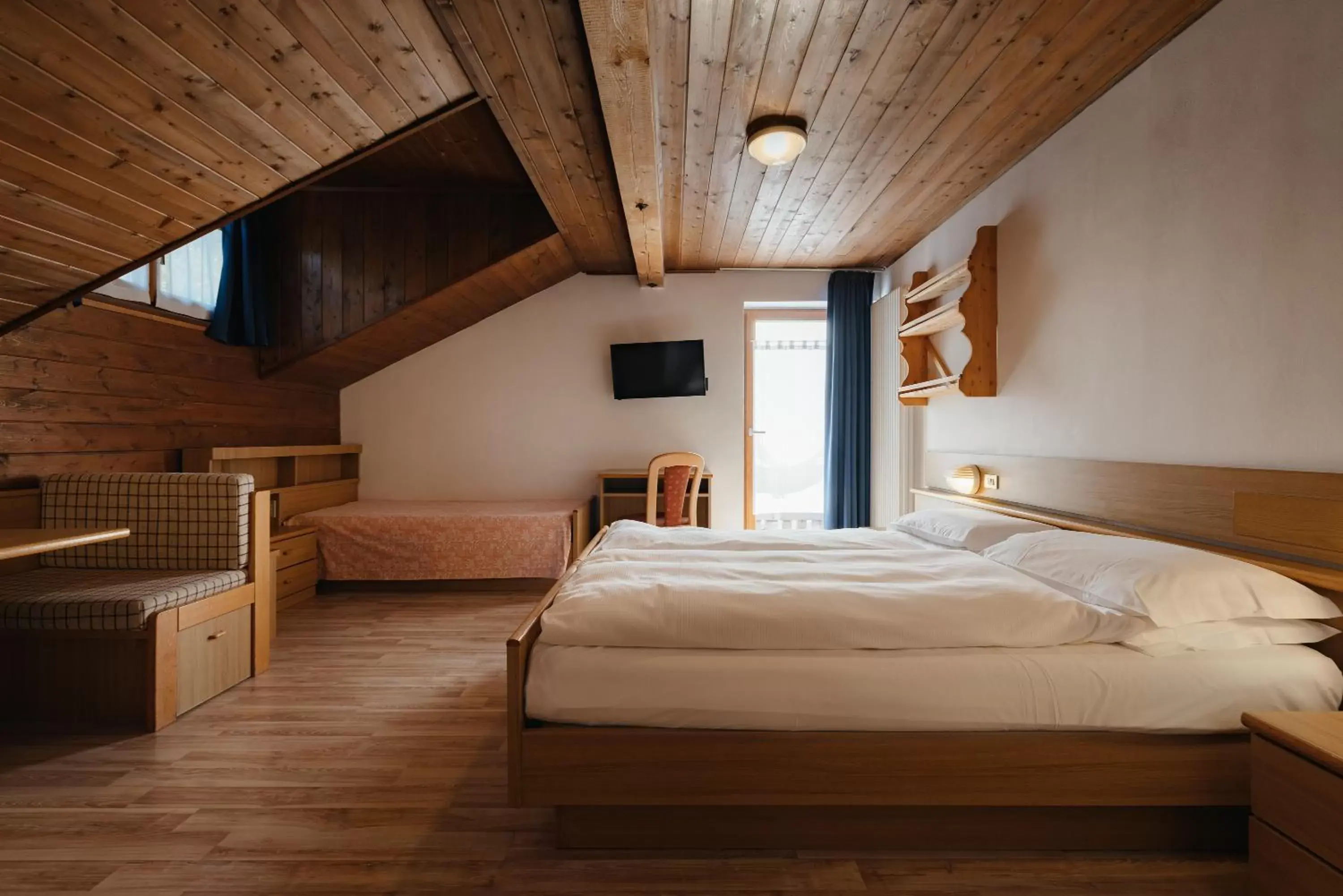 Photo of the whole room, Bed in Hotel La Montanara Predazzo