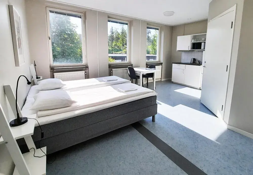 Kitchen or kitchenette, Bed in Sidsjö Hotell & Konferens