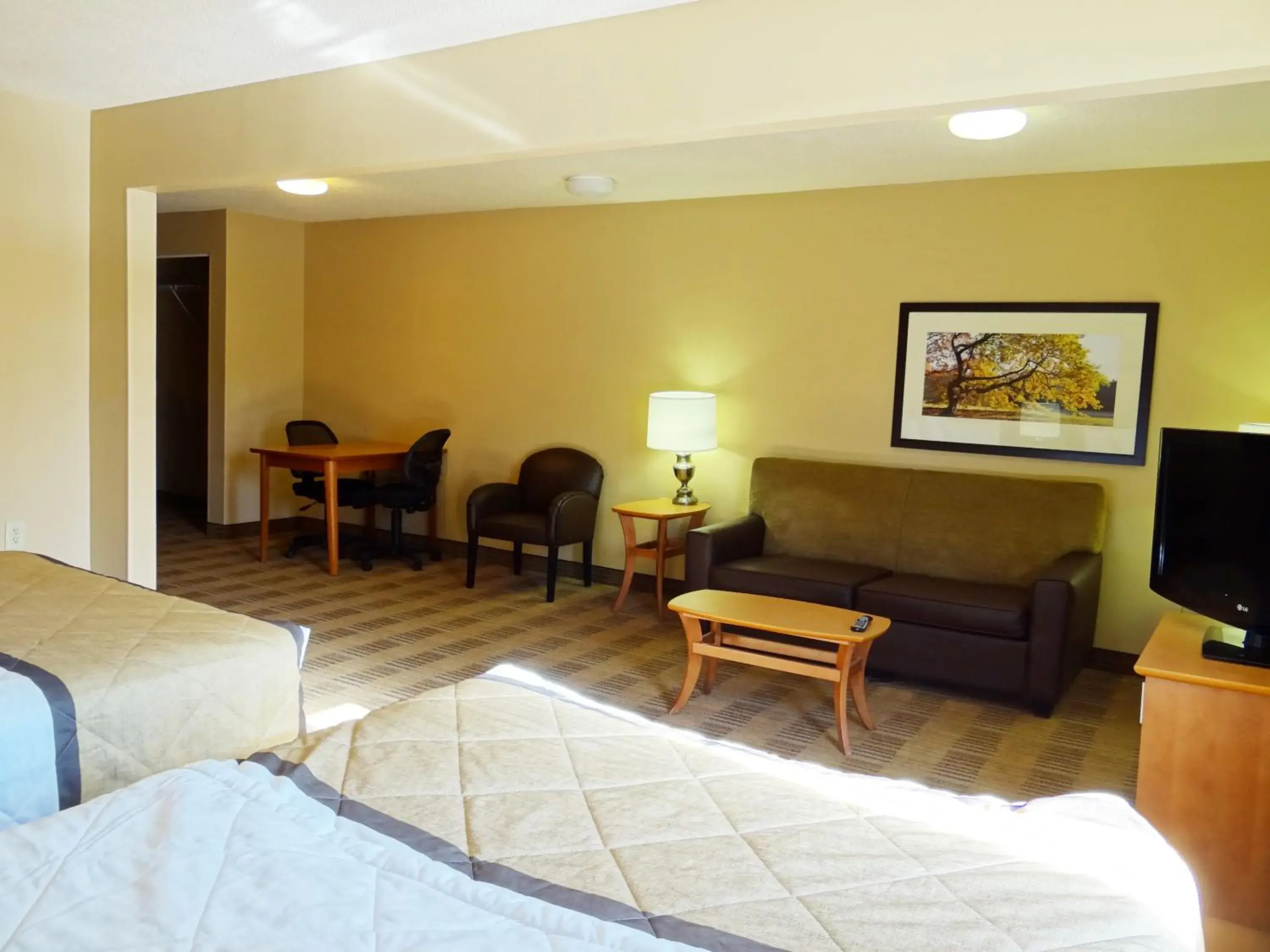 Bed, Seating Area in Extended Stay America Suites - Raleigh - Cary - Regency Parkway South