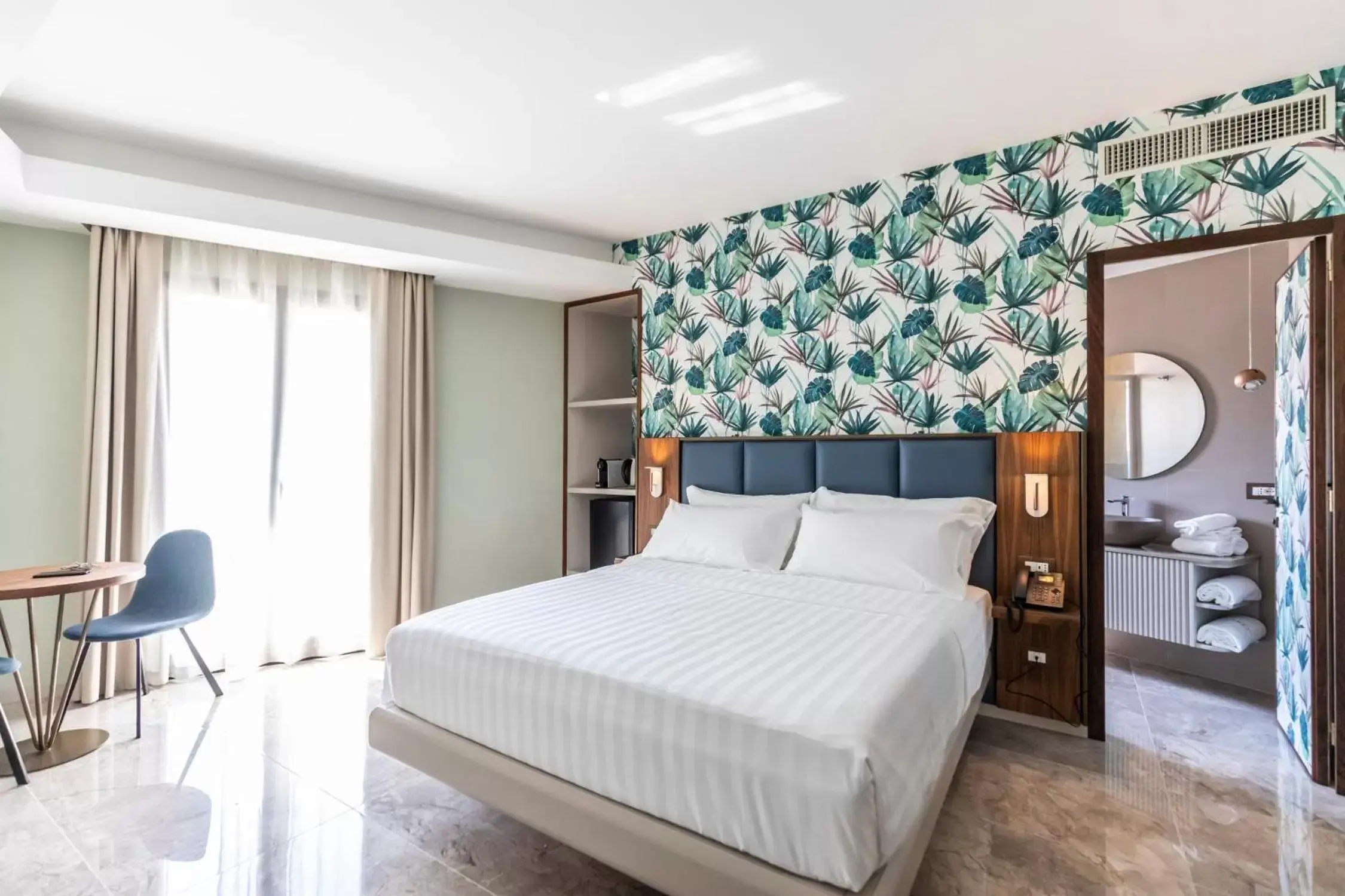 Bed in Solmaris Tropea Rooms & Suites