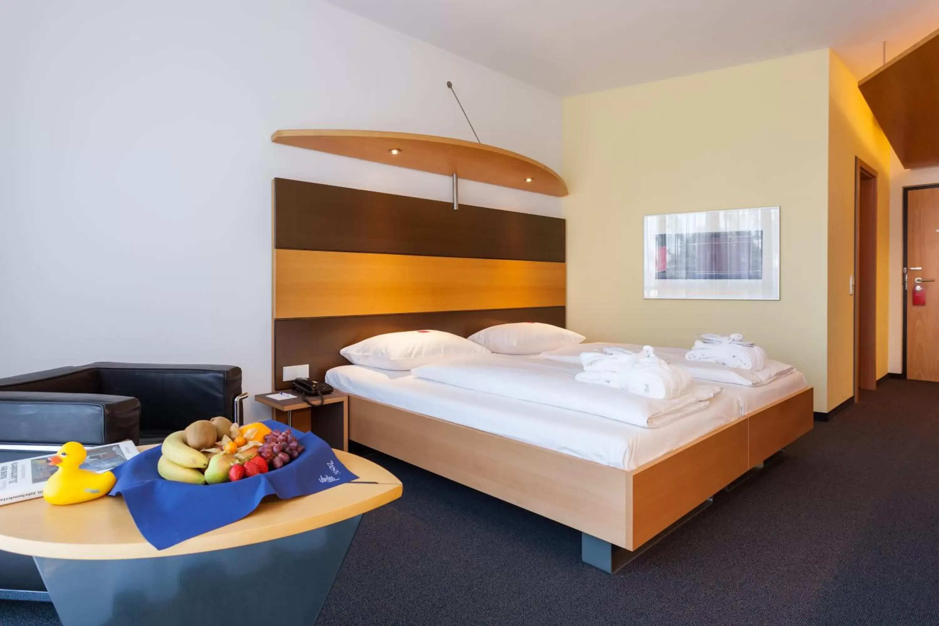 Photo of the whole room, Bed in SEEhotel Friedrichshafen