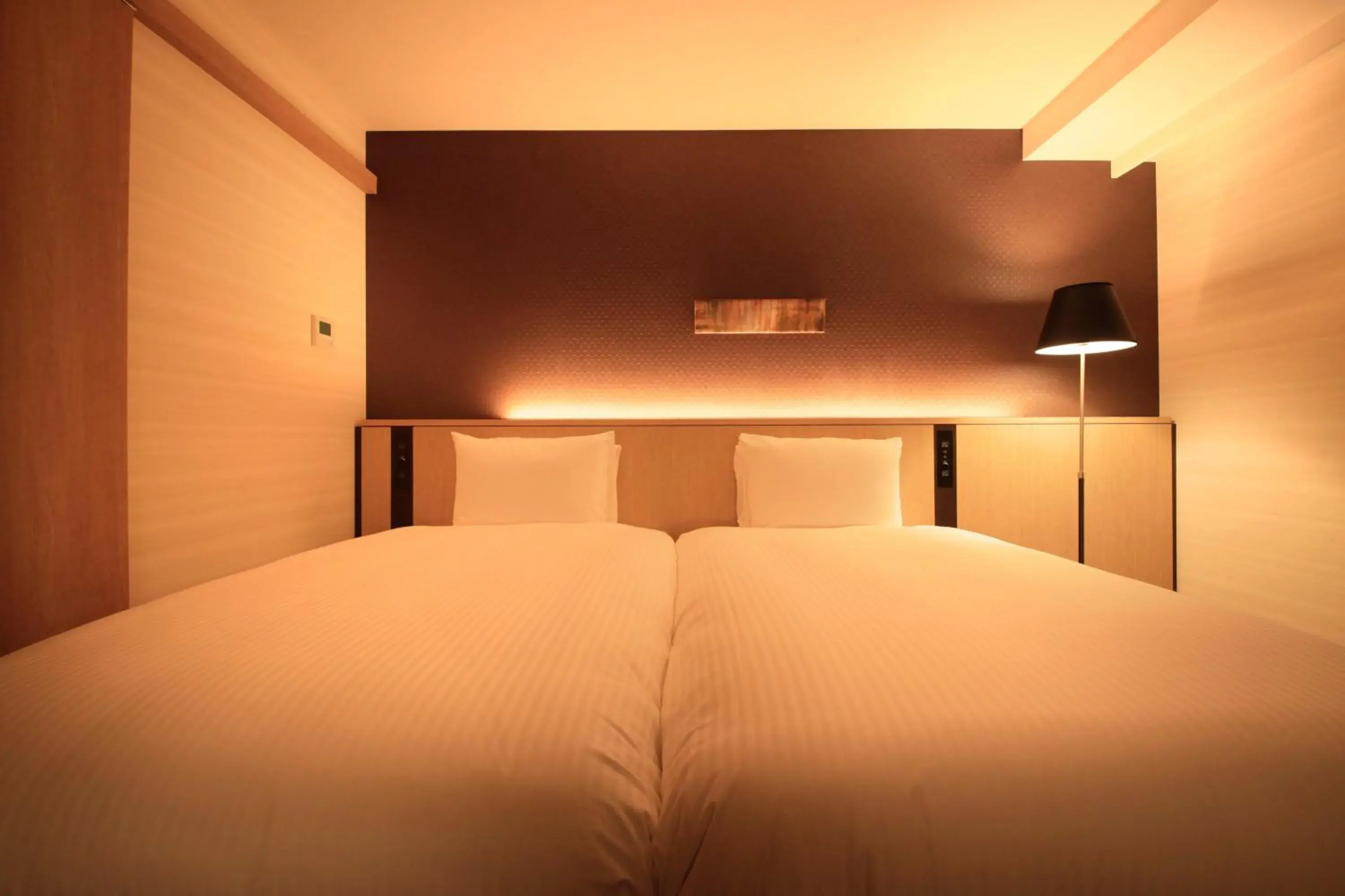 Bed in Richmond Hotel Yokohama Ekimae